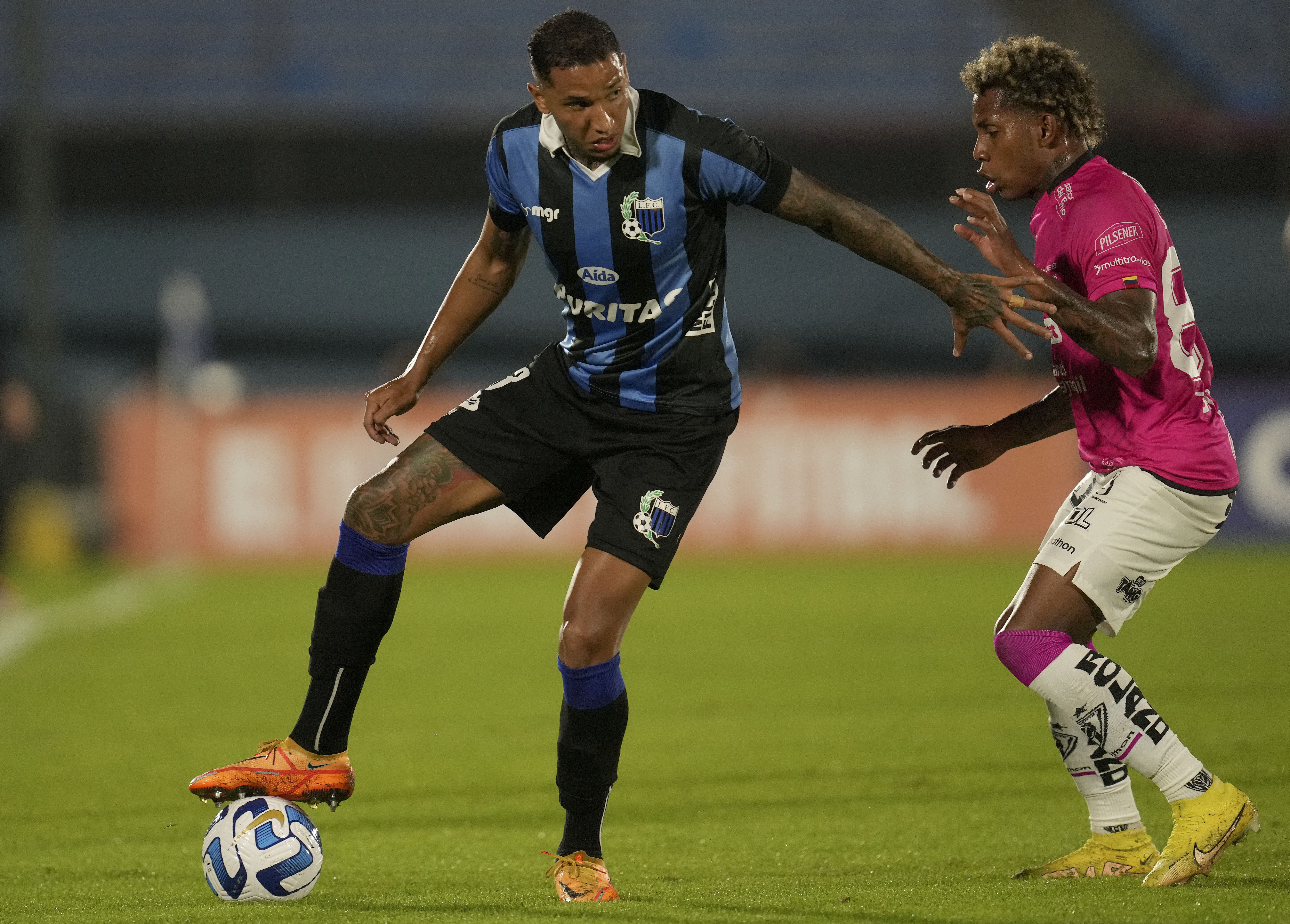 FILE - Juan Manuel Izquierdo of Uruguay's Liverpool, left, controls the ball under pressure from Julio Joao Ortiz of Ecuador's Independiente del Valle at a Copa Libertadores soccer match in Montevideo, Uruguay, May 24, 2023. 