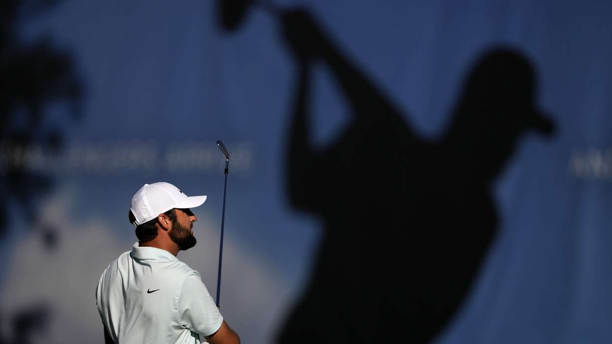 Scottie Scheffler hits on the driving range prior to the third round of the BMW Championship golf event at Castle Pines Golf Club, Saturday, Aug. 24, 2024, in Castle Rock, Colo.