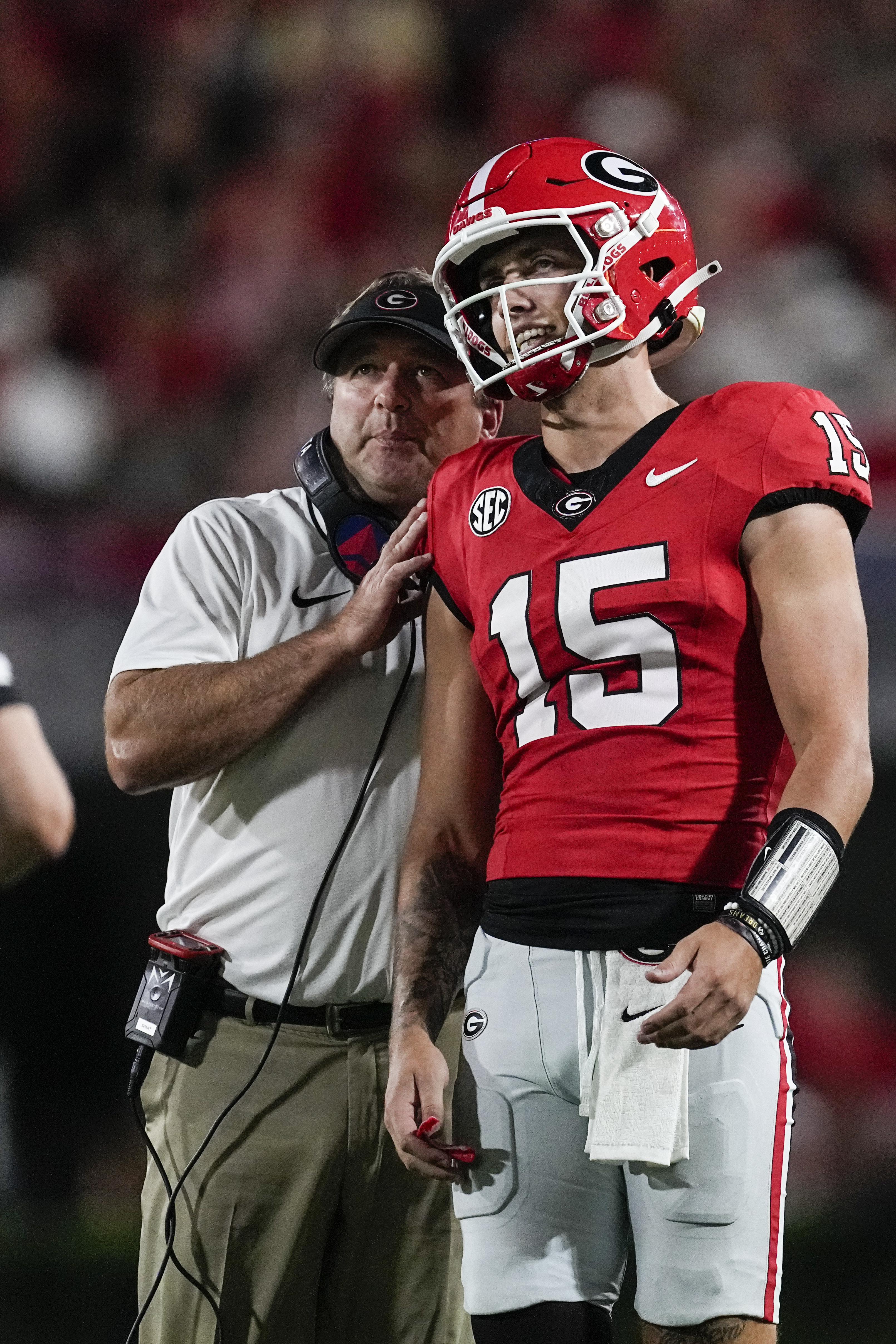 FILE - Georgia head coach Kirby Smart talks with his quarterback Carson Beck during the first half of an NCAA college football game against UAB, Saturday, Sept. 23, 2023, in Athens, Ga.