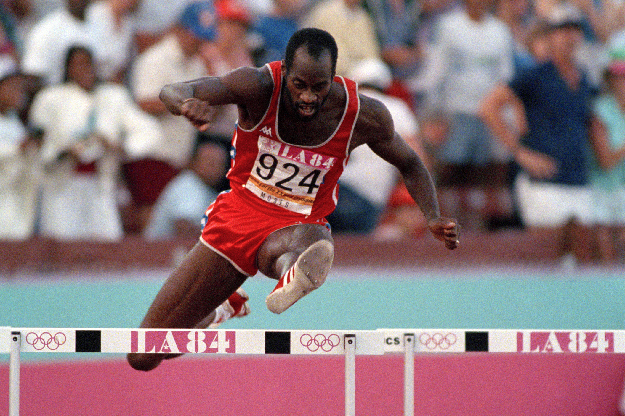FILE - United States' Edwin Moses jumps a hurdle on his way to winning the gold medal in the 400-meter hurdles at the Summer Olympic Games in Los Angeles, Aug. 5, 1984. 