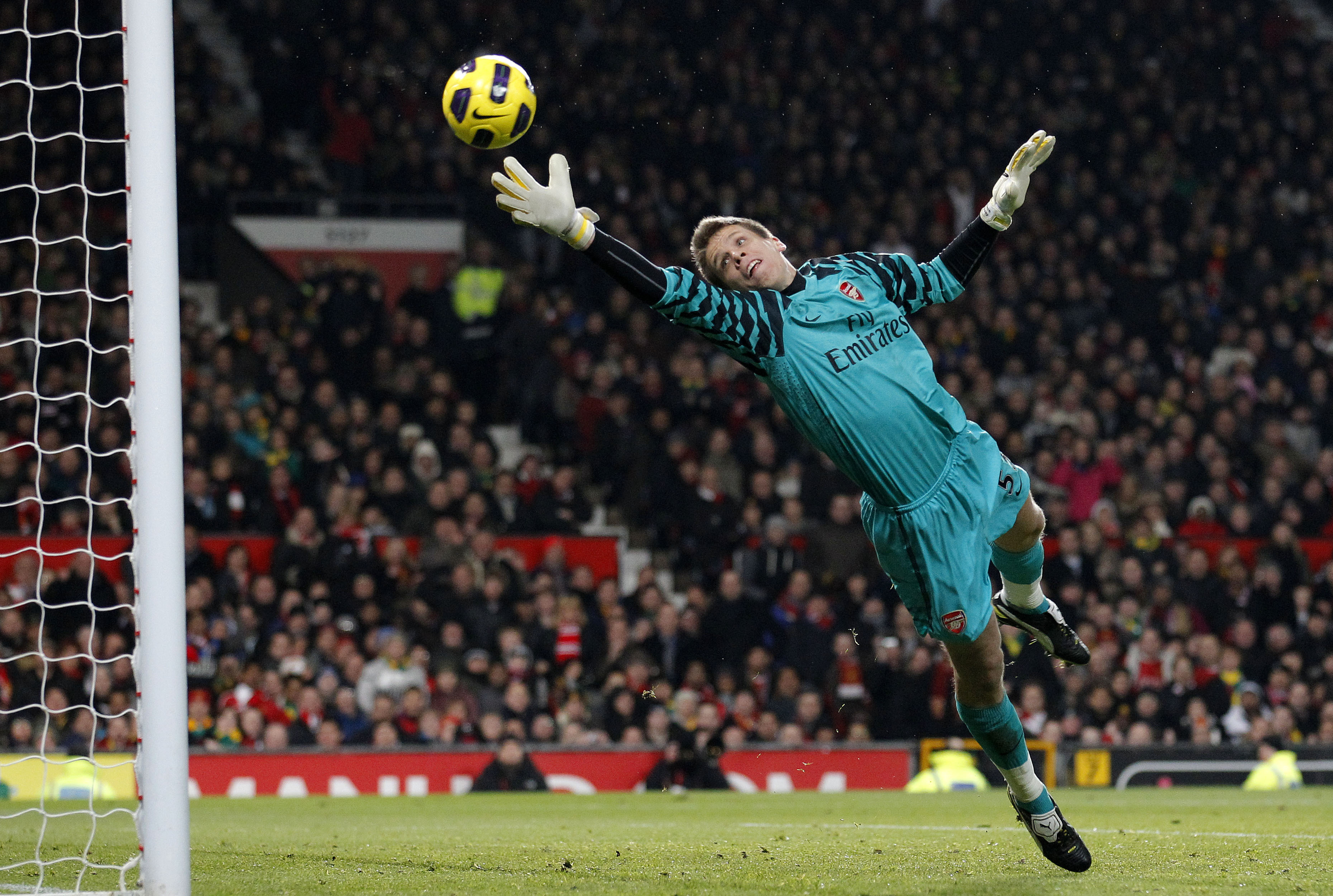 FILE - Arsenal goalkeeper Wojciech Szczesny watches a header from Manchester United's Ji-Sung Park go into the goal during their English Premier League soccer match at Old Trafford, Manchester, England, Monday Dec. 13, 2010.