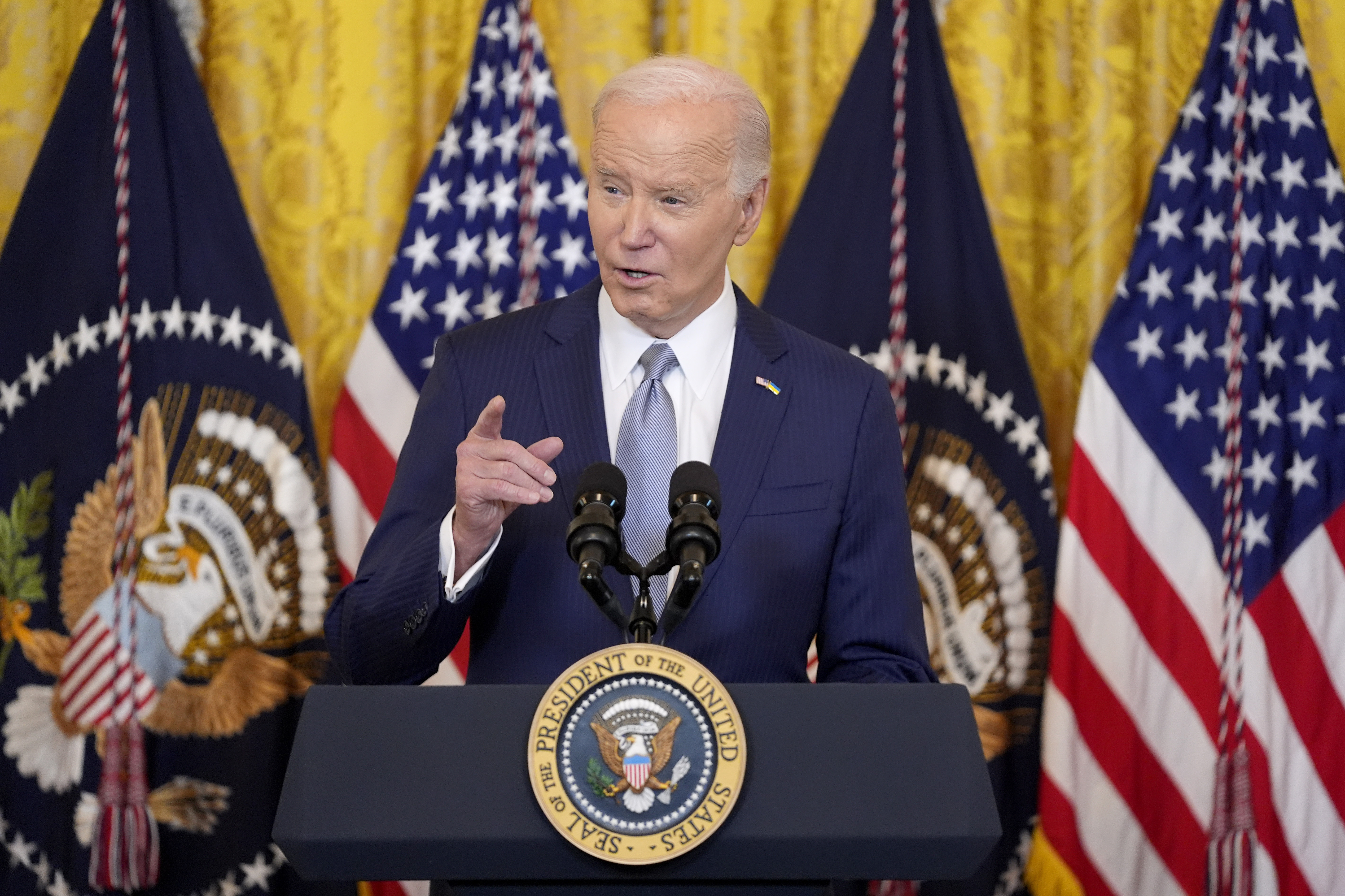 President Joe Biden speaks at the White House, Feb. 23 in Washington. Immigration attorneys say families are in limbo after a federal judge in Texas paused a Biden administration immigration program.
