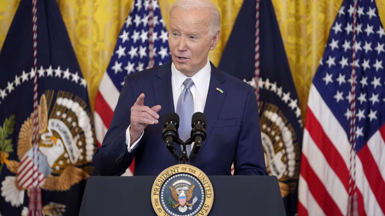 President Joe Biden speaks at the White House, Feb. 23 in Washington. Immigration attorneys say families are in limbo after a federal judge in Texas paused a Biden administration immigration program.