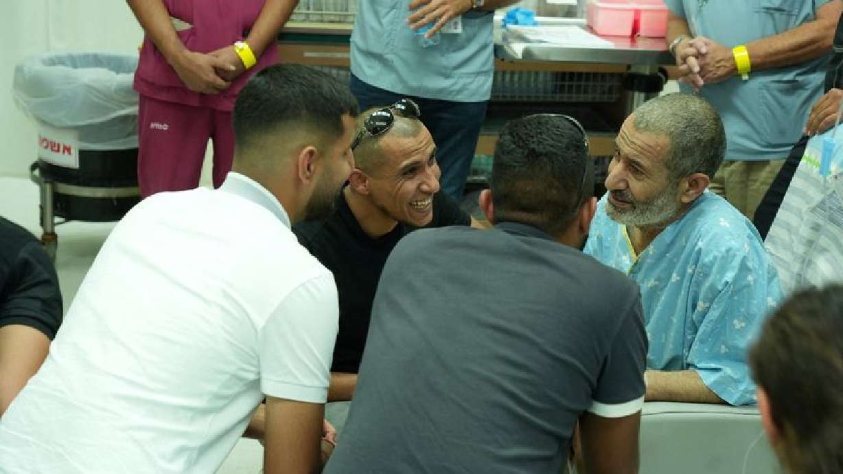 Qaid Farhan Alkadi, a Bedouin Israeli hostage who was kidnapped in the deadly Oct. 7 Hamas attack, is reunited with loved ones at Soroka Medical Center in Beersheba, Israel, in this handout photo dated Tuesday.