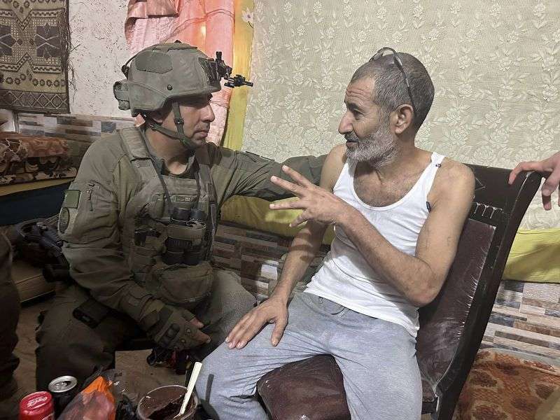 Qaid Farhan Alkadi, right, and the commanding officer of the 162nd Division, Brig. Gen. Itzik Cohen talk after a rescue operation on Tuesday.