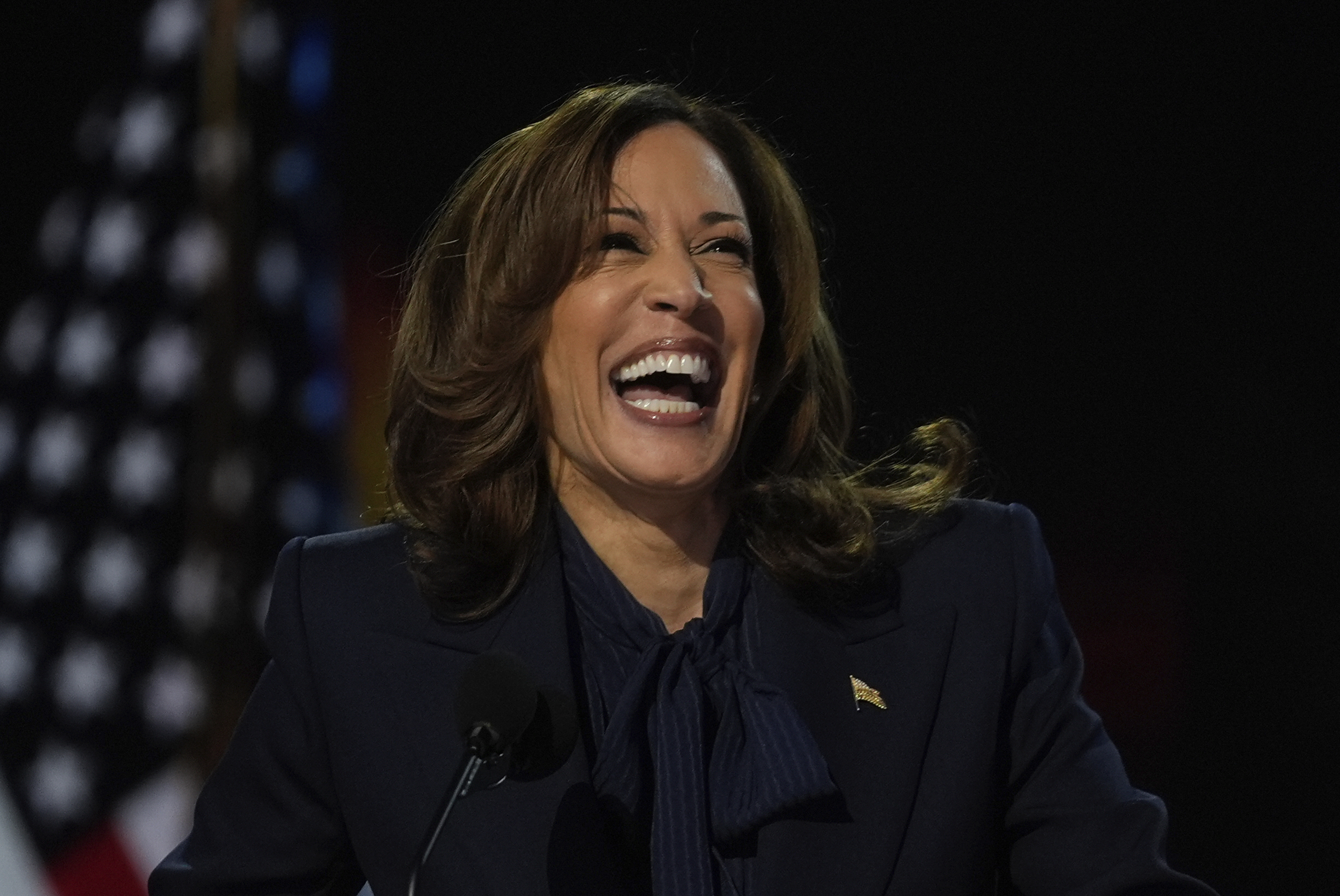 Democratic presidential nominee Vice President Kamala Harris laughs Aug. 22 in Chicago. Staffers of former Republican nominees issued a letter supporting Harris's nomination.