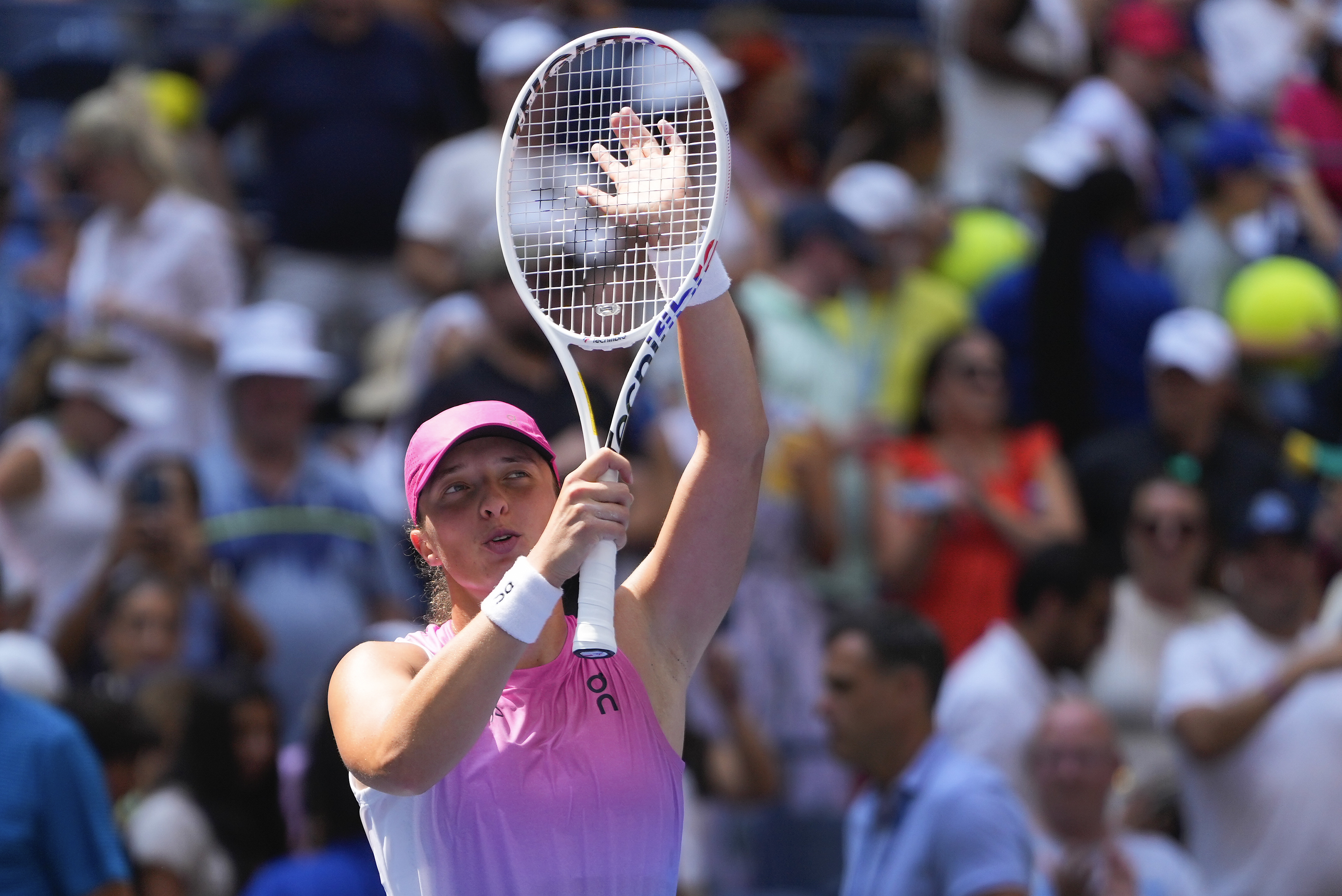 Iga Swiatek, of Poland, waves to fans after defeating Kamilla Rakhimova, during the first round of the U.S. Open tennis championships, Tuesday, Aug. 27, 2024, in New York. 