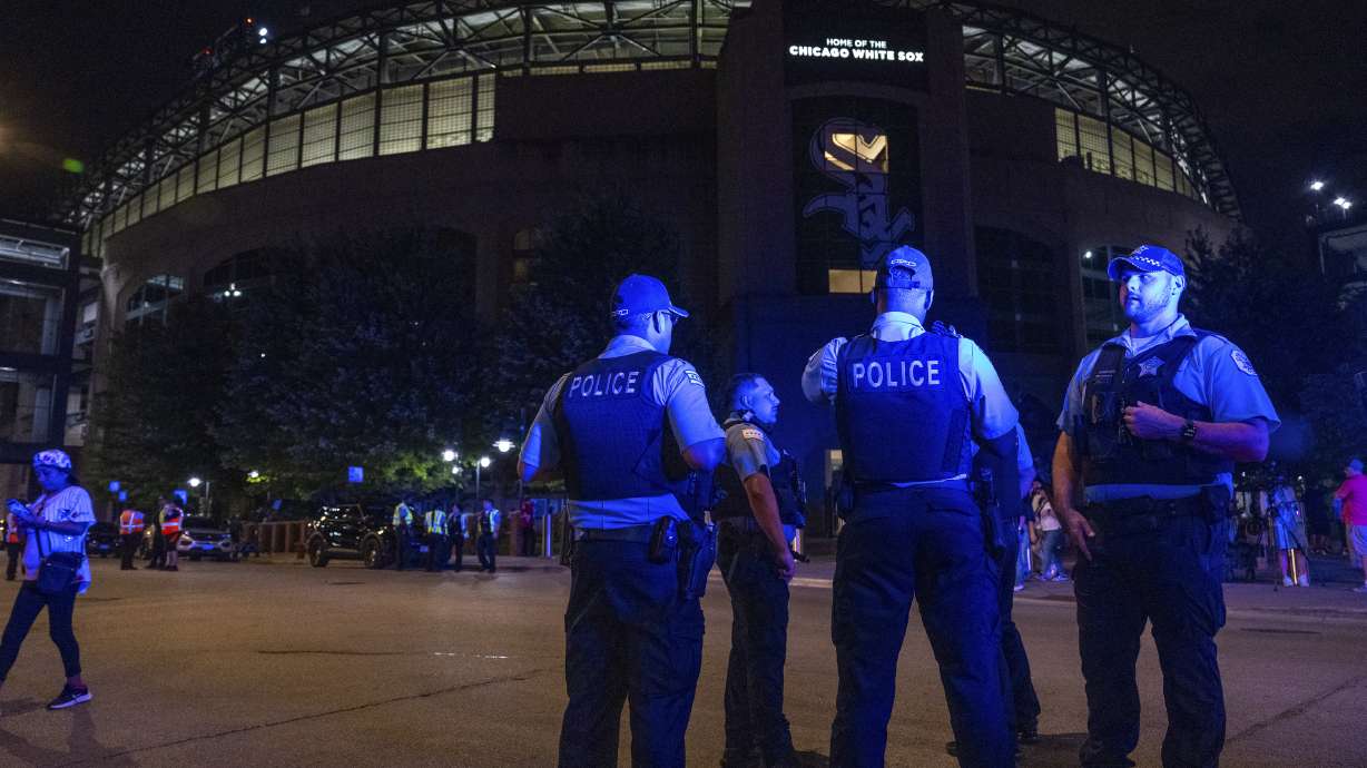 FILE - Chicago police officers respond to a shooting during a White Sox's game at Guaranteed Rate Field, Aug. 25, 2023, in Chicago.