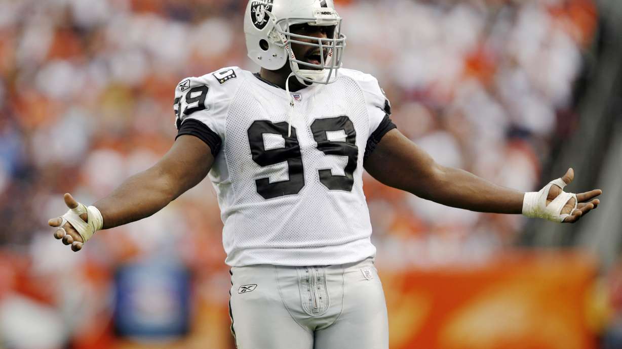 FILE - Oakland Raiders defensive tackle Warren Sapp argues with officials in the third quarter of the Denver Broncos' 23-20 victory in overtime of an NFL football game in Denver on Sunday, Sept. 16, 2007.