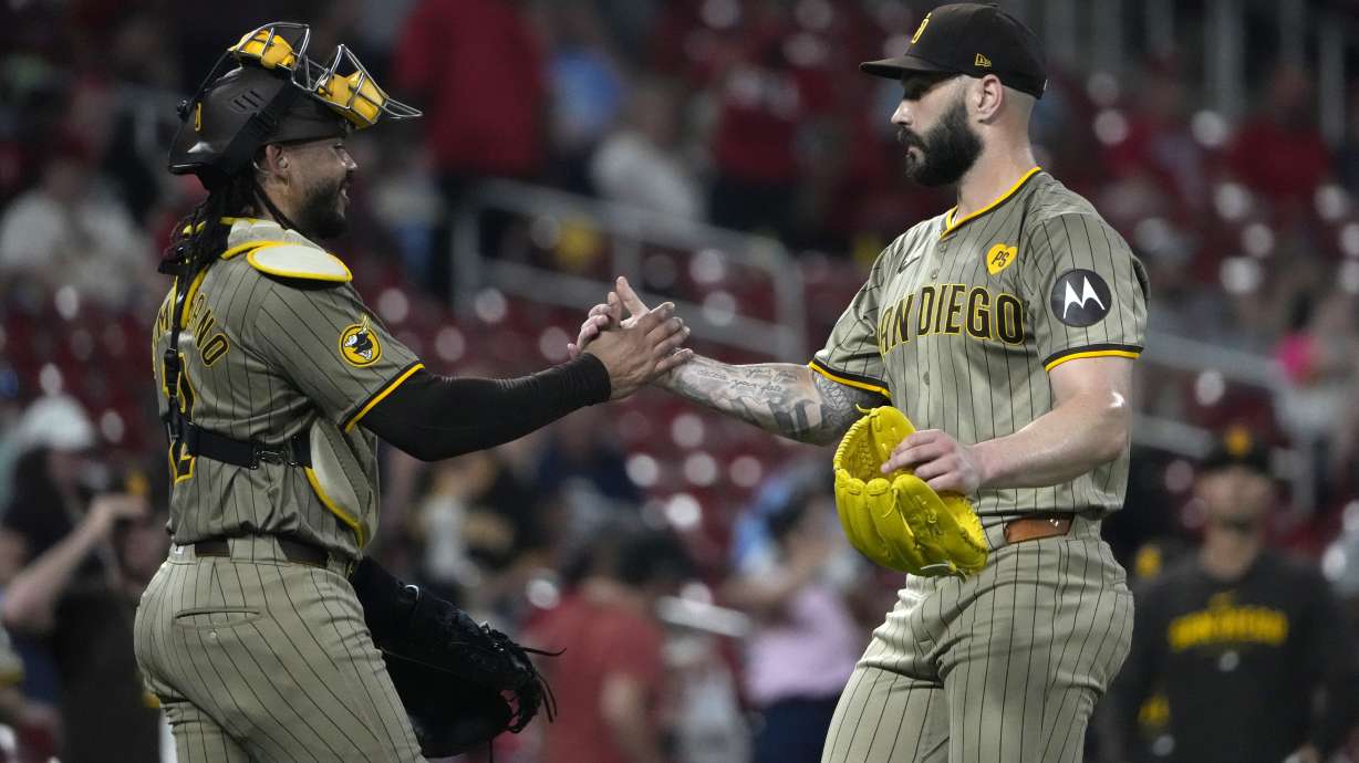 San Diego Padres pitcher Tanner Scott celebrates with catcher Luis Campusano following a 7-5 victory over the St. Louis Cardinals in a baseball game Tuesday, Aug. 27, 2024, in St. Louis.