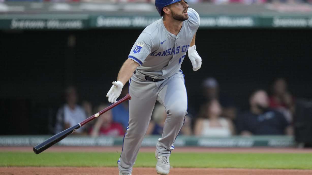 Kansas City Royals' Paul DeJong watches his home run in the second inning of a baseball game against the Cleveland Guardians, Tuesday, Aug. 27, 2024, in Cleveland.