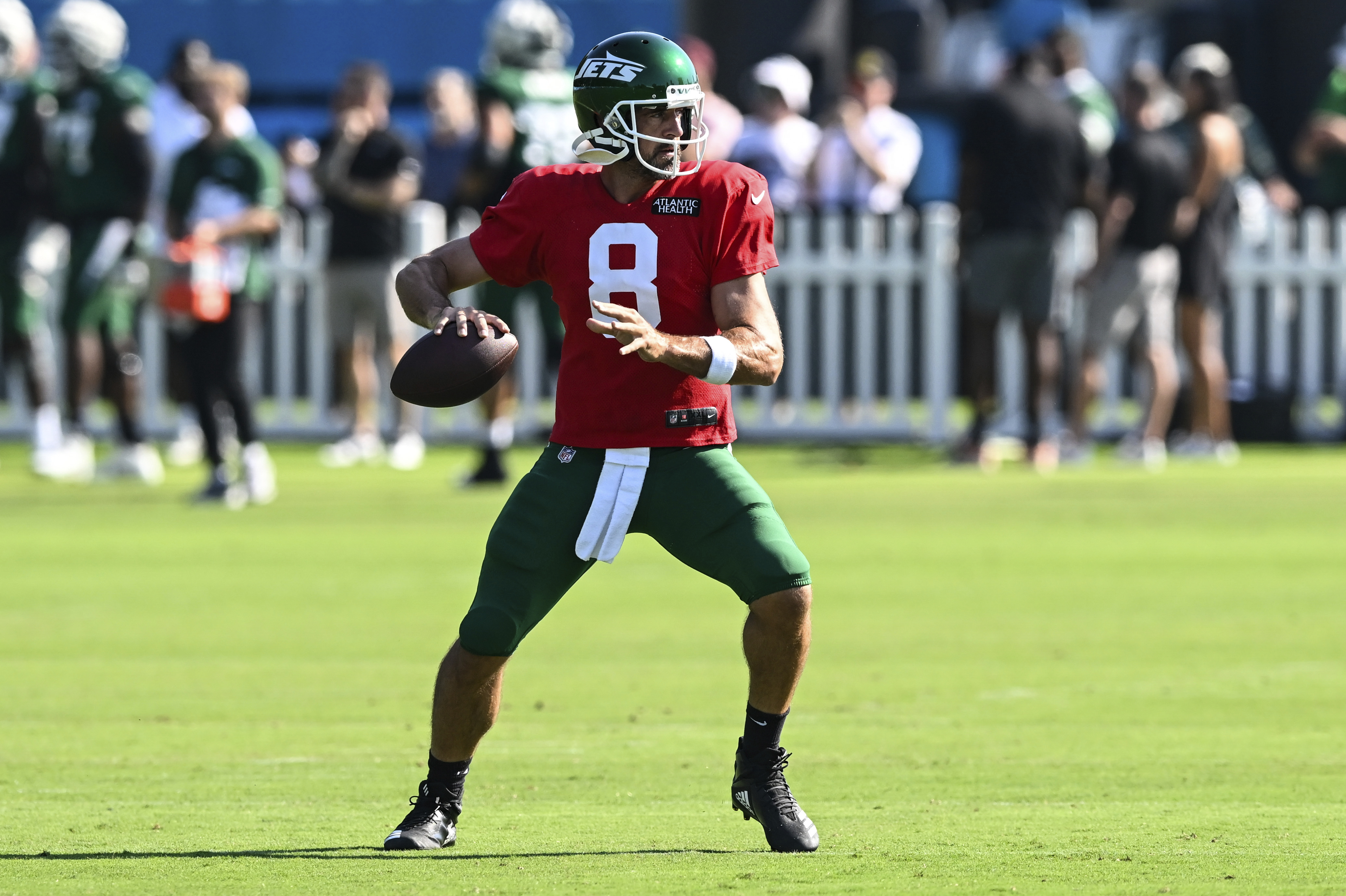 New York Jets quarterback Aaron Rodgers drops back to throw a pass during an NFL football joint practice with the Carolina Panthers Thursday, Aug. 15, 2024, in Charlotte, N.C. 