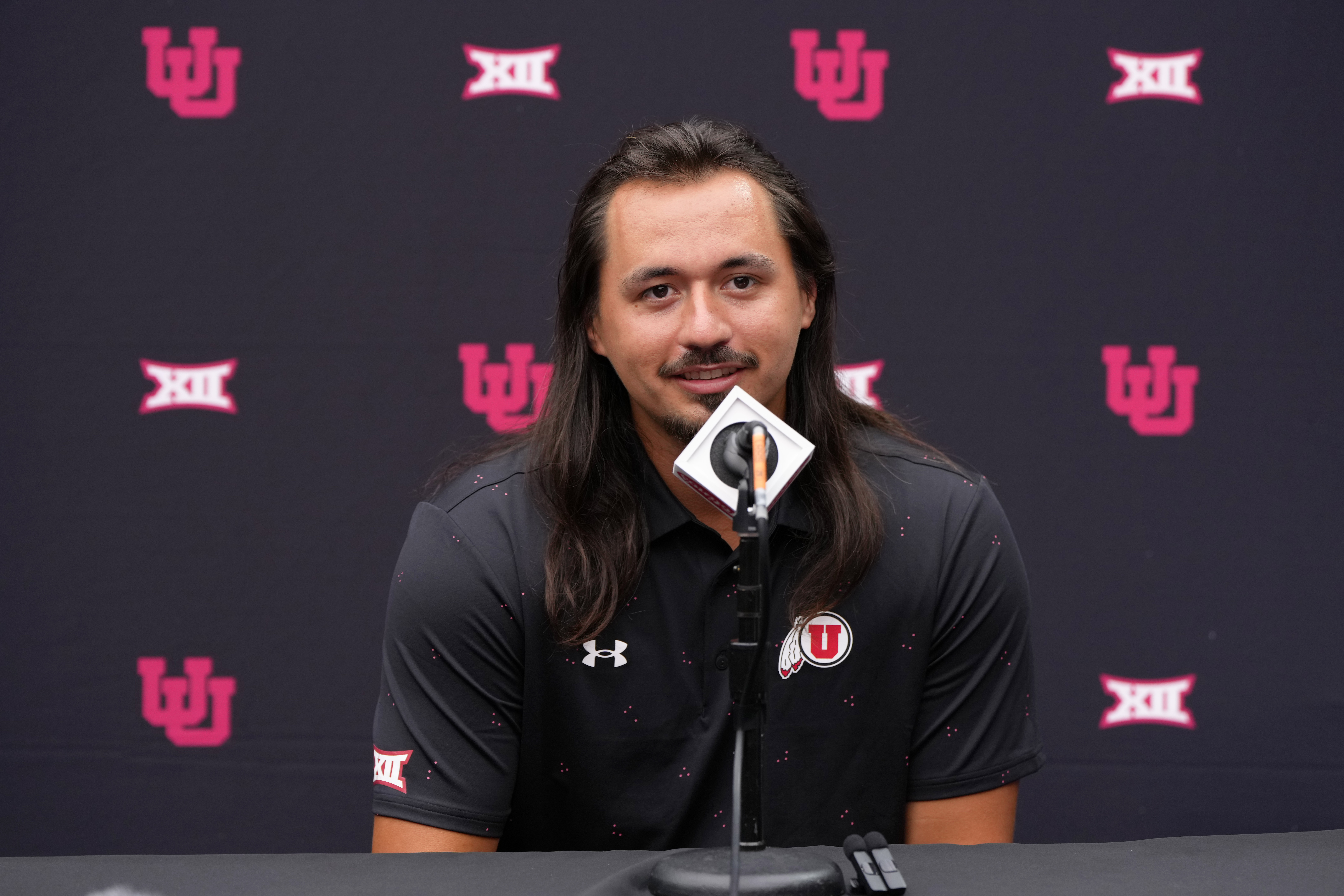 FILE - Utah quarterback Cameron Rising answers questions from the media during the Big 12 NCAA college football media days in Las Vegas, Tuesday, July 9, 2024. 