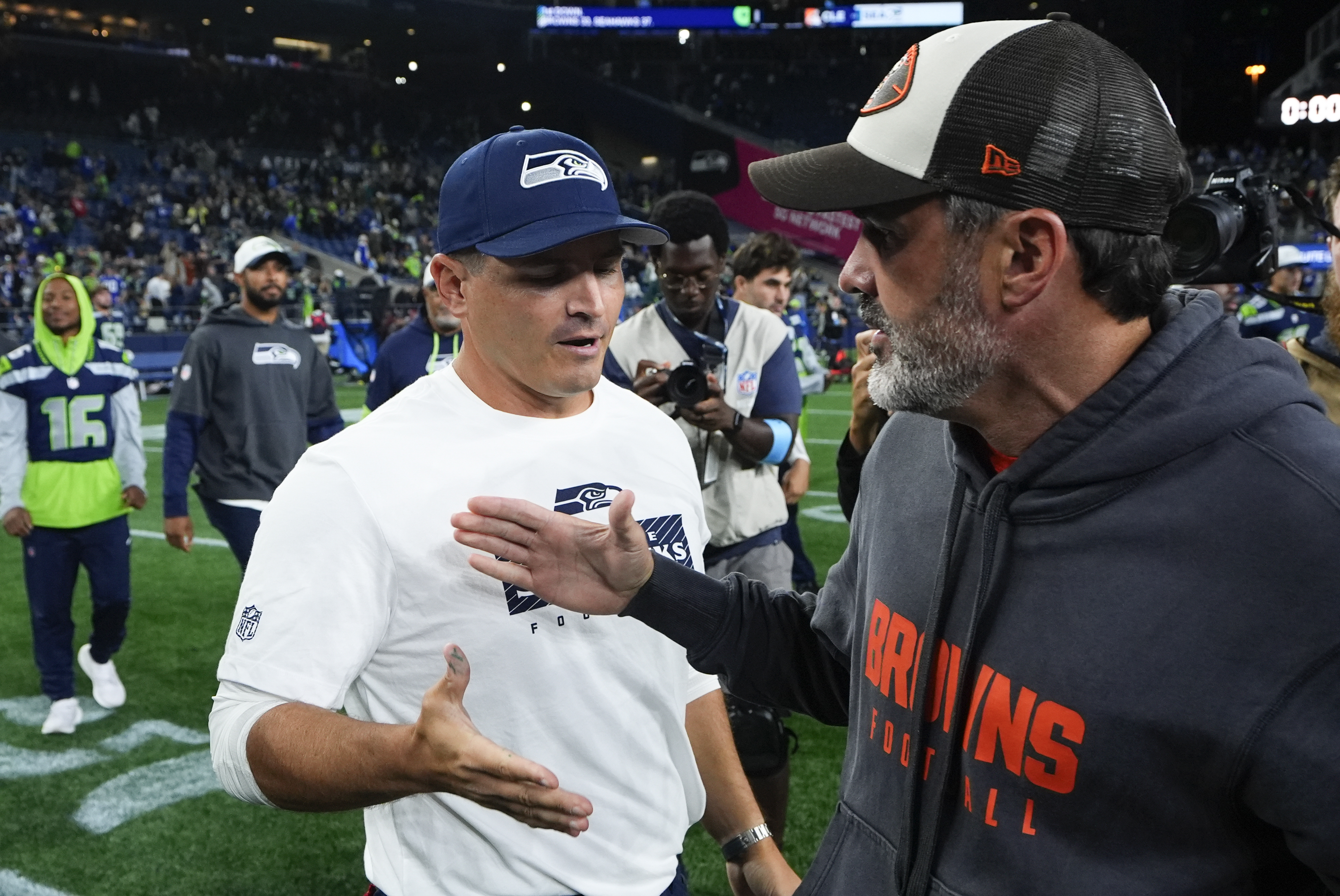 Seattle Seahawks head coach Mike Macdonald, left, shakes hands with Cleveland Browns head coach Kevin Stefanski after a preseason NFL football game Saturday, Aug. 24, 2024, in Seattle. The Seahawks won 37-33. 