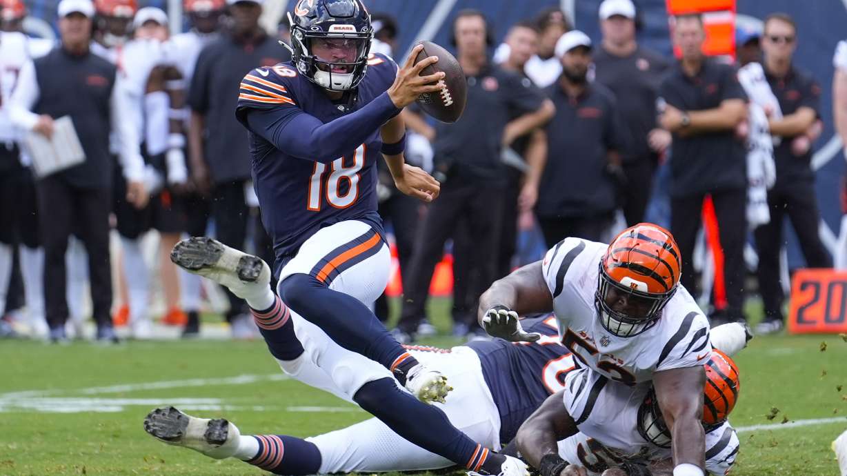 Chicago Bears quarterback Caleb Williams (18) breaks away from a tackle against the Cincinnati Bengals during the first half of an NFL preseason football game, Saturday, Aug. 17, 2024, at Soldier Field in Chicago.