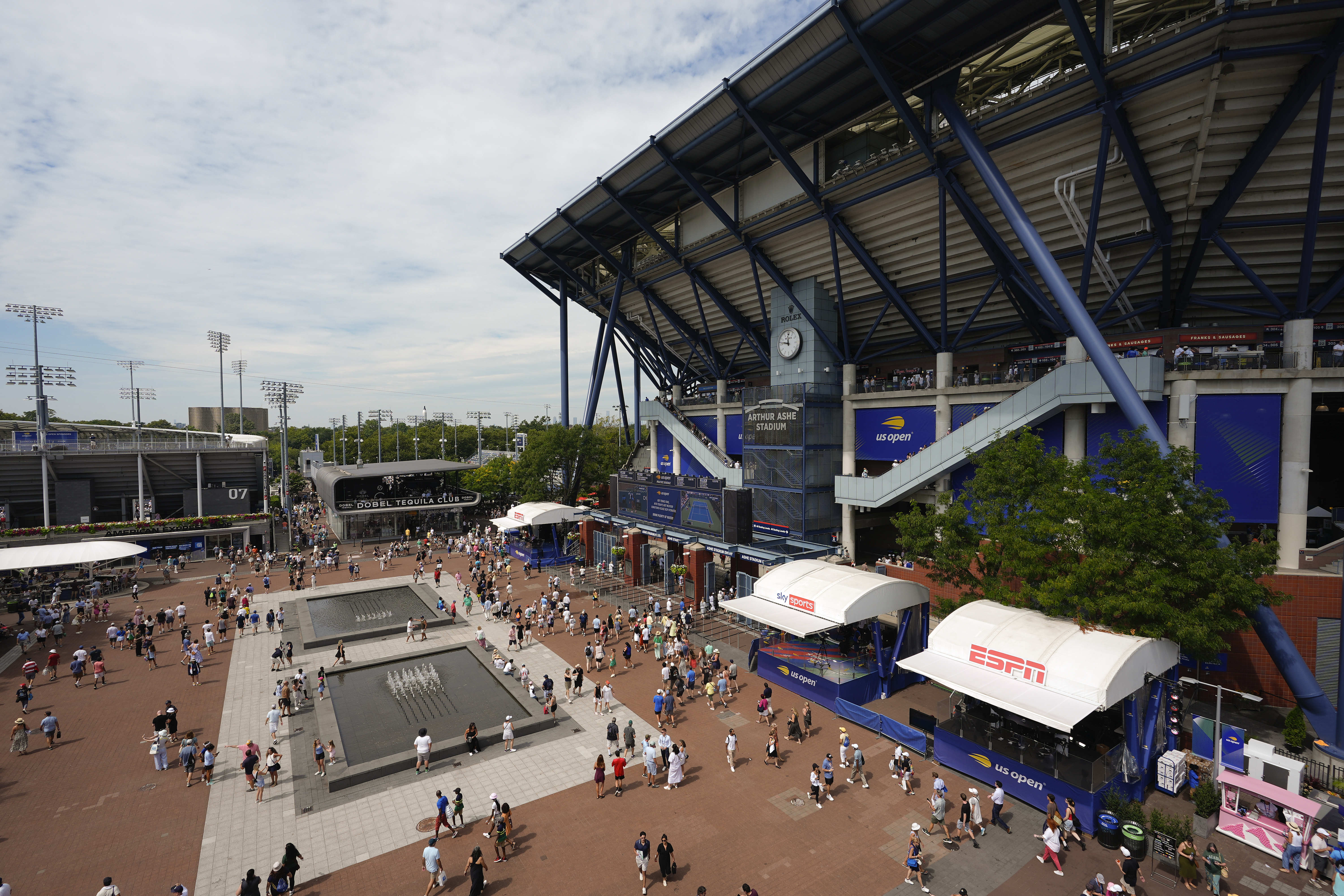 Tennis fans walk the grounds of the Billie Jean King National Tennis Center during the second round of the U.S. Open tennis championships, Wednesday, Aug. 28, 2024, in New York.