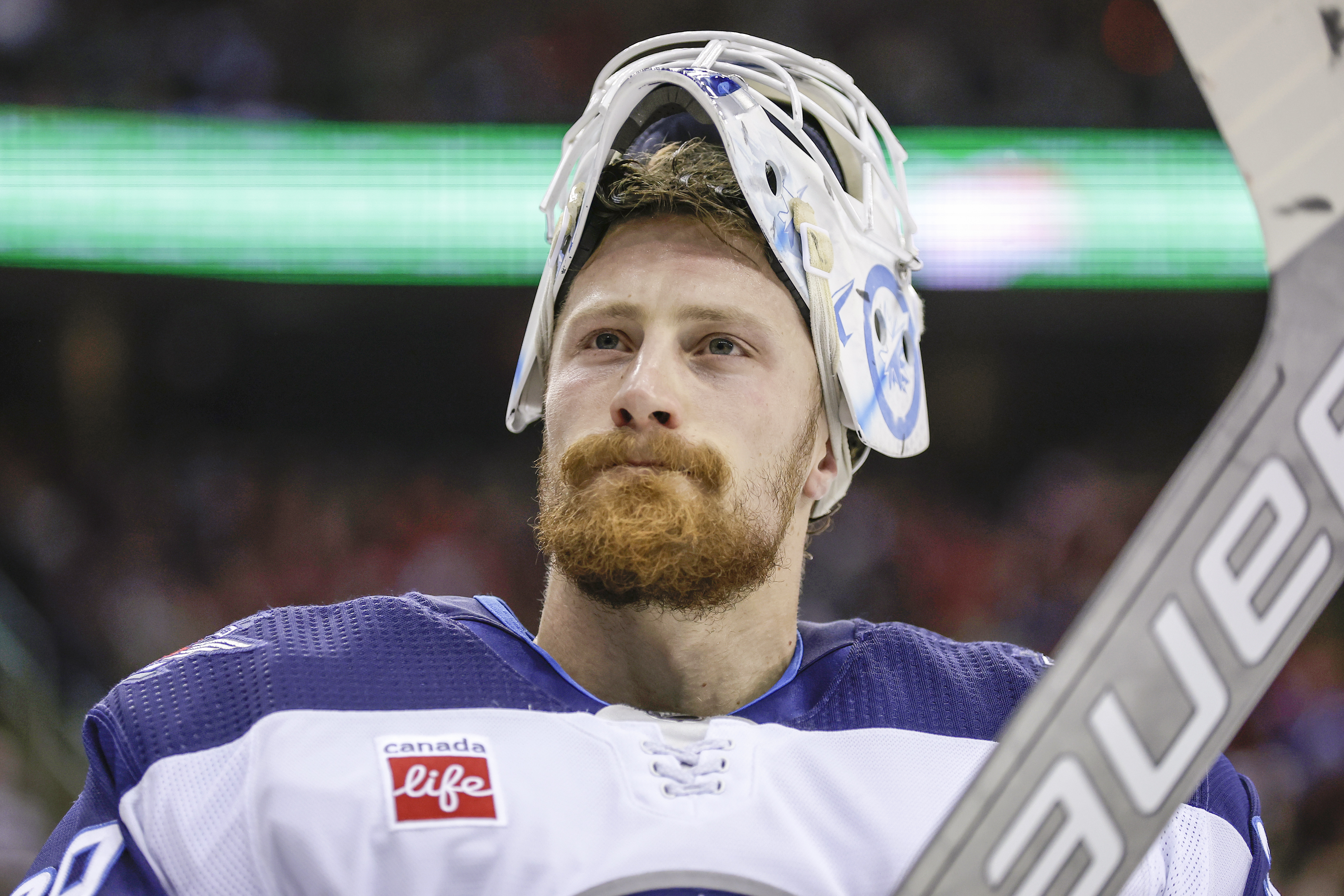FILE - Winnipeg Jets goaltender Laurent Brossoit (39) reacts against the New Jersey Devils during the second period of an NHL hockey game Thursday, March 21, 2024, in Newark, N.J. 