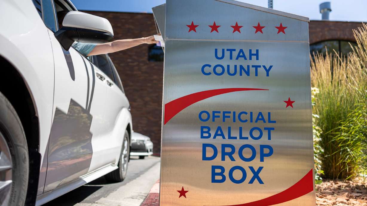 A voter drops a ballot in a drop box at the Orem Public Library in Orem on June 25. The Safeguard American Voter Eligibility Act requires people registering to vote in federal elections to provide documentary proof of citizenship.