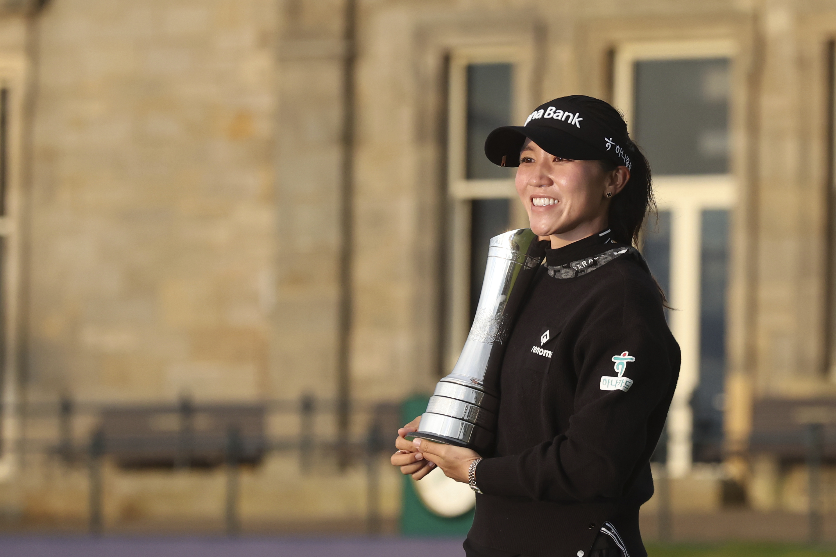 Lydia Ko of New Zealand, poses for the media with the trophy after winning the Women's British Open golf championship, and becoming Champion golfer, in St. Andrews, Scotland, Sunday, Aug. 25, 2024. 