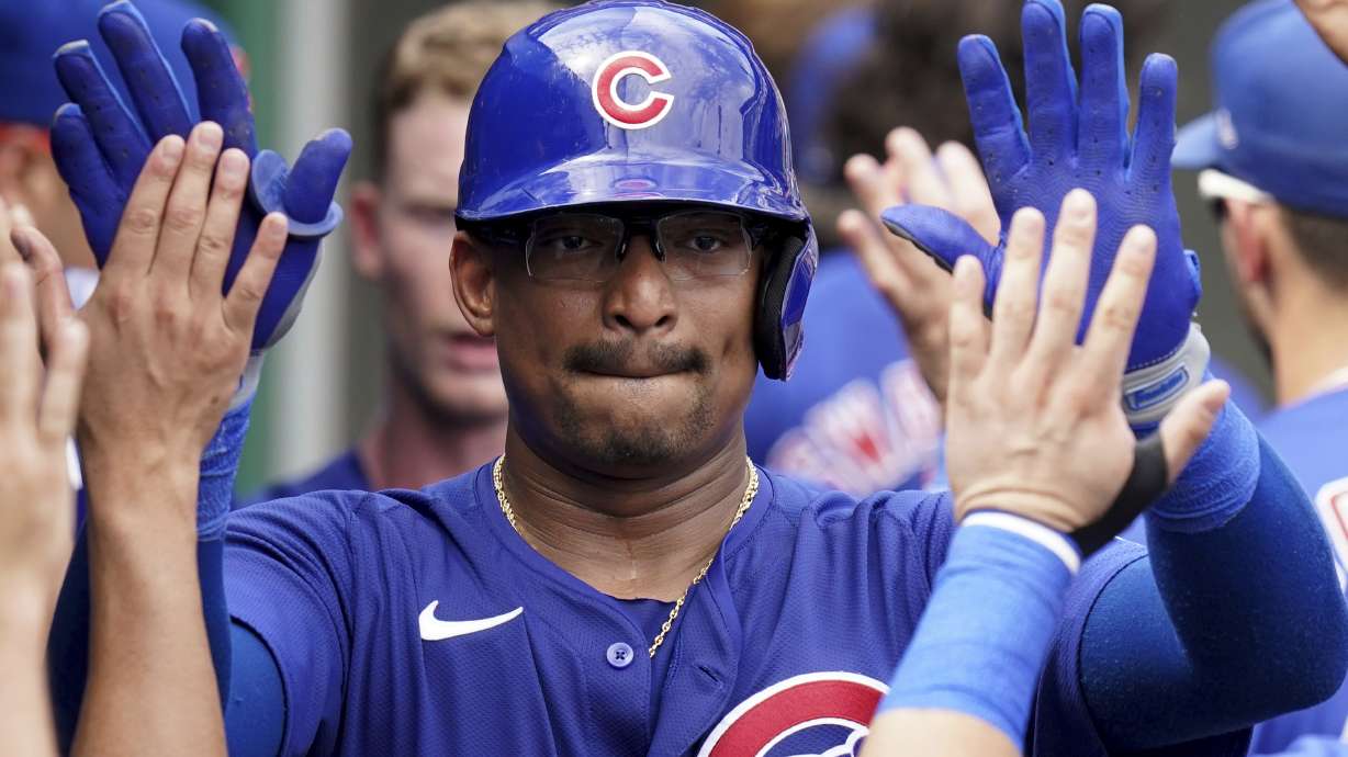 Chicago Cubs' Christian Bethancourt celebrates in the dugout after hitting a two-run home run during the seventh inning of a baseball game against the Pittsburgh Pirates Wednesday, Aug. 28, 2024, in Pittsburgh.