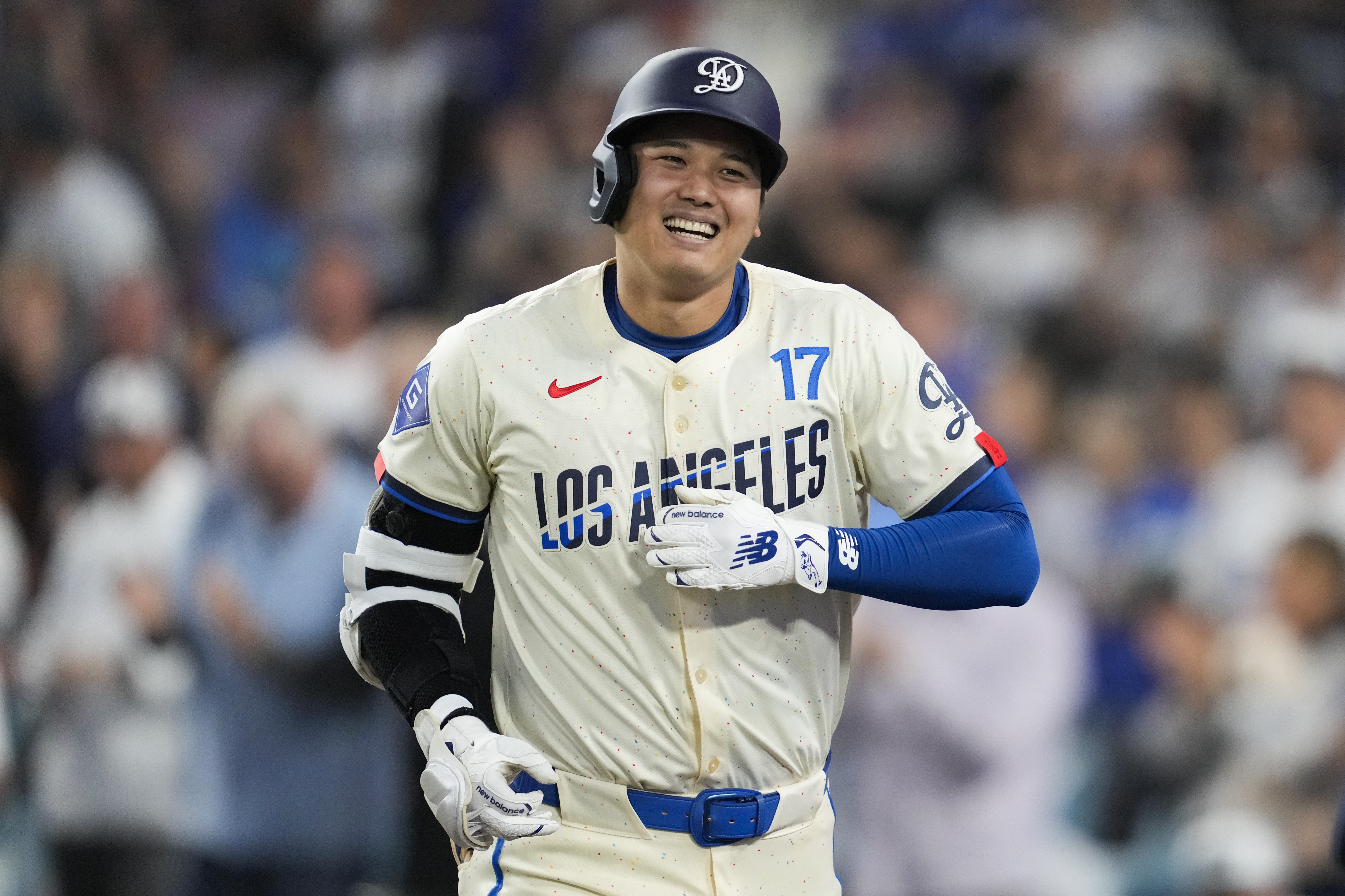 Los Angeles Dodgers designated hitter Shohei Ohtani (17) reacts after hitting a home run during the fifth inning of a baseball game against the Tampa Bay Rays in Los Angeles, Saturday, Aug. 24, 2024. Miguel Rojas also scored. 