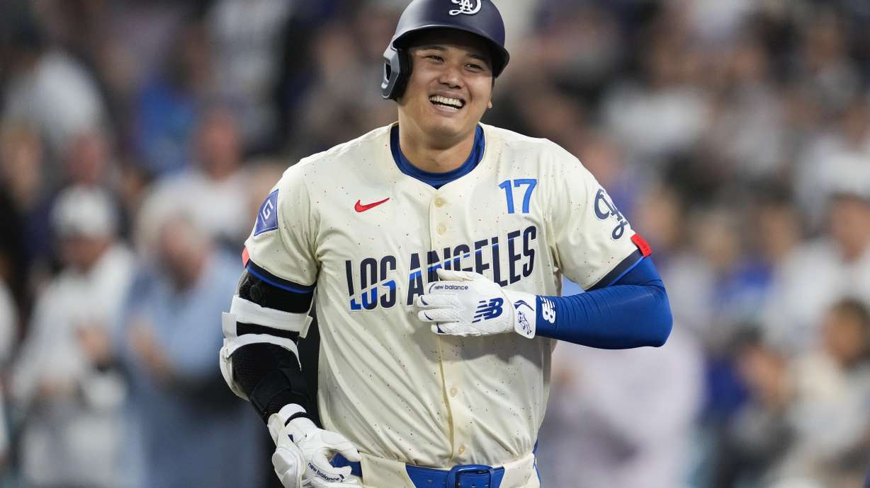 Los Angeles Dodgers designated hitter Shohei Ohtani (17) reacts after hitting a home run during the fifth inning of a baseball game against the Tampa Bay Rays in Los Angeles, Saturday, Aug. 24, 2024. Miguel Rojas also scored.