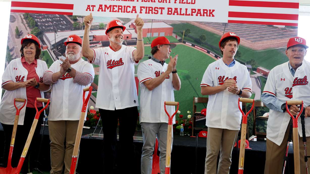 Charlie Monfort, Colorado Rockies owner/general partner and University of Utah alum, raises his arms while singing the Utah Fight Song during the Construction Celebration for Charlie Monfort Field at America First Ballpark in Salt Lake City on Wednesday, Aug. 28, 2024.