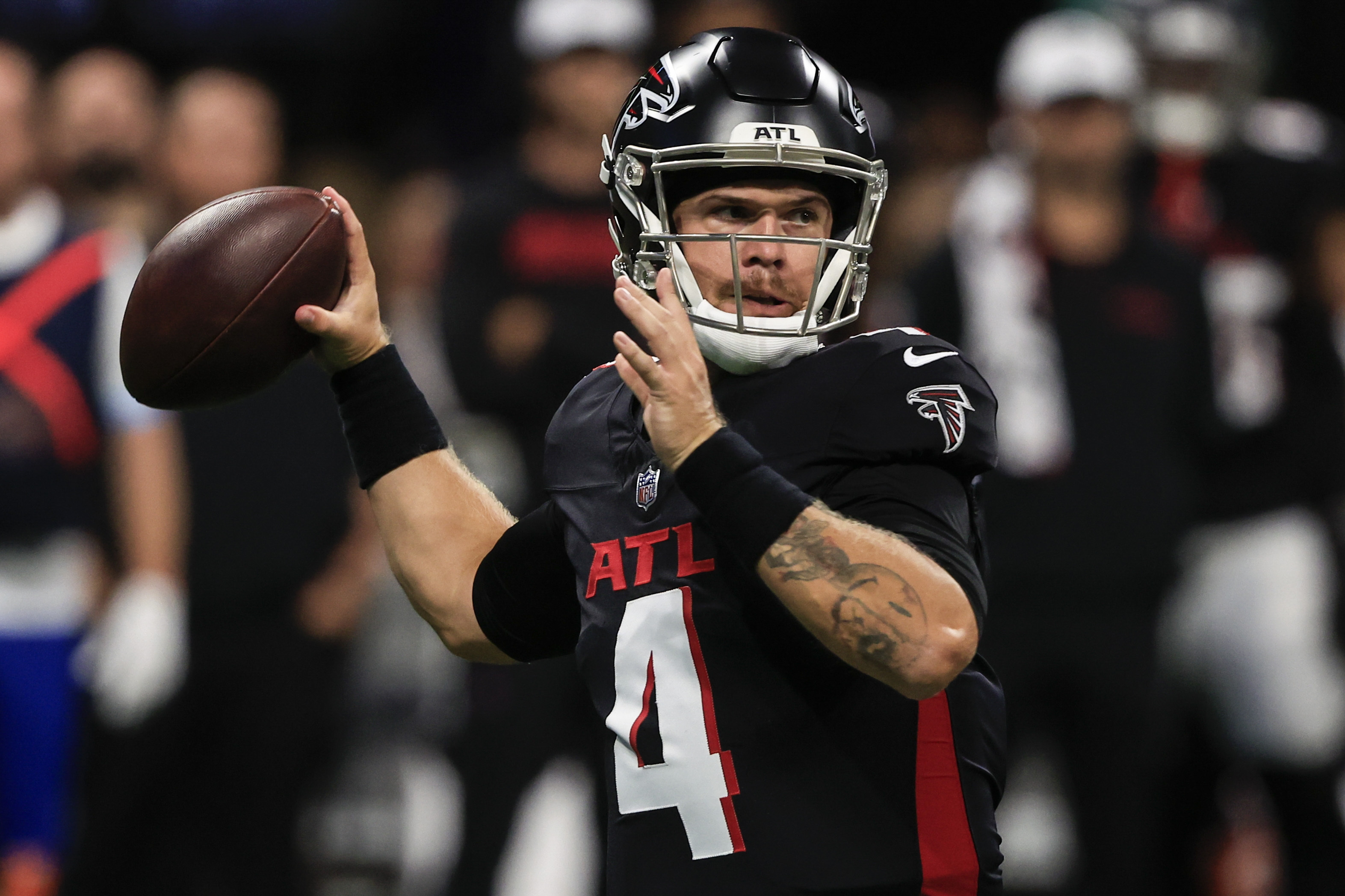Atlanta Falcons quarterback Taylor Heinicke (4) works in the pocket against the Jacksonville Jaguars in the first half of an NFL preseason footballl game, Friday, Aug. 23, 2024, in Atlanta. 