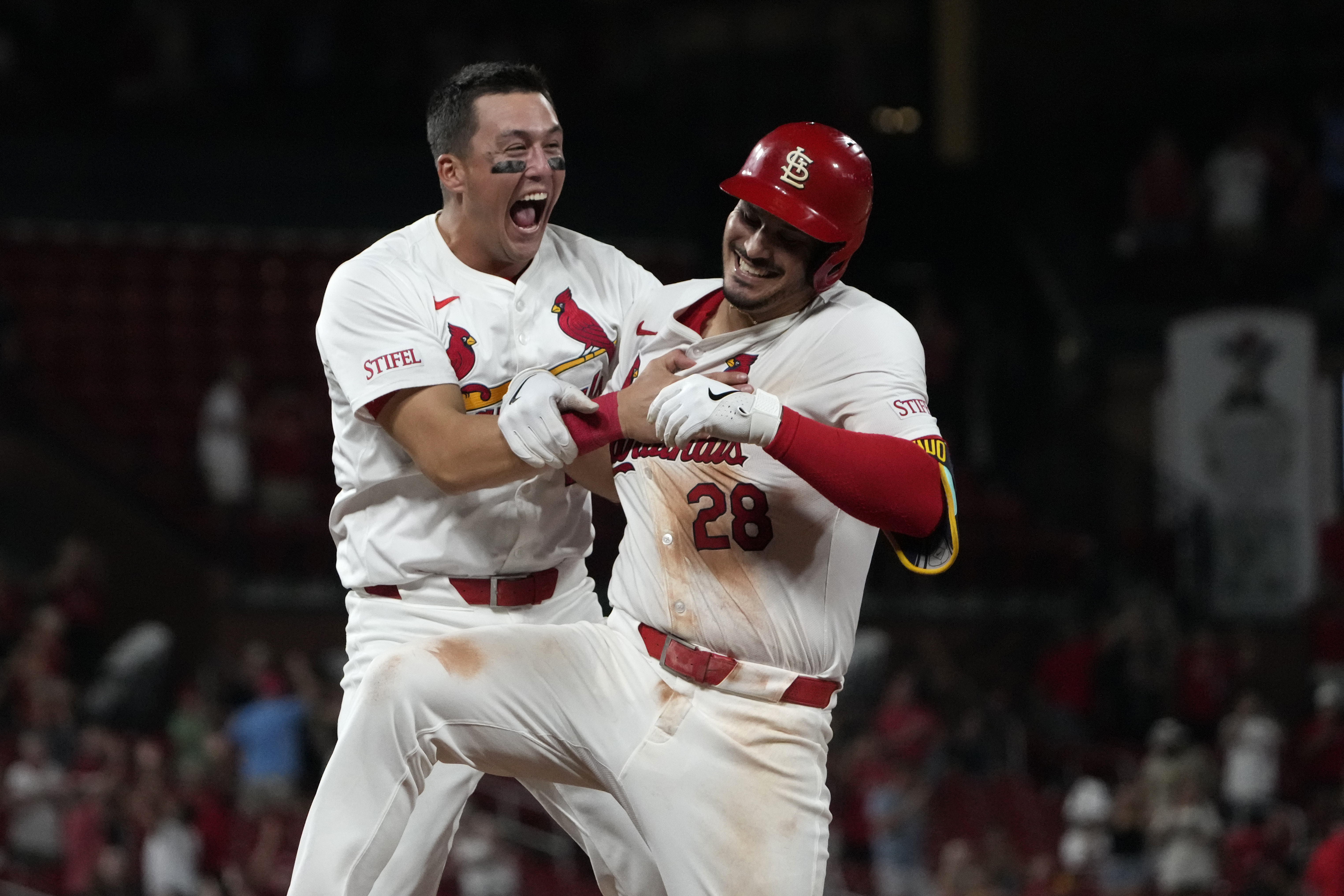 St. Louis Cardinals' Nolan Arenado, right, is congratulated by teammate Lars Nootbaar after hitting a walk-off single to defeat the San Diego Padres 4-3 in a baseball game Wednesday, Aug. 28, 2024, in St. Louis. 