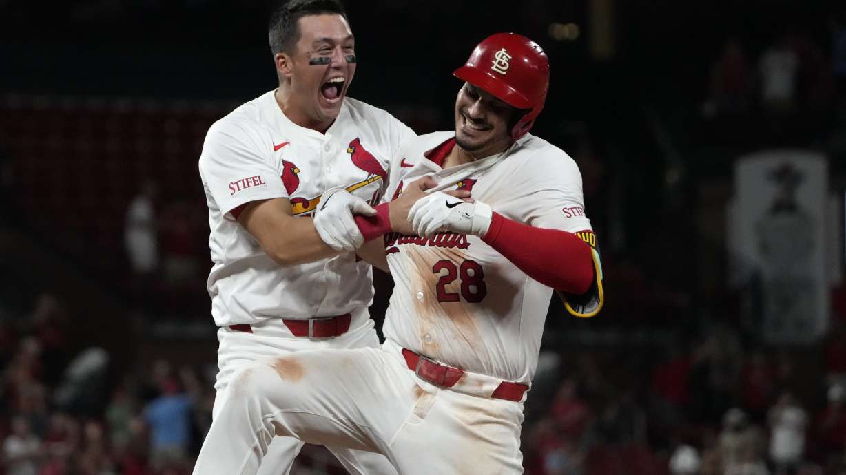 St. Louis Cardinals' Nolan Arenado, right, is congratulated by teammate Lars Nootbaar after hitting a walk-off single to defeat the San Diego Padres 4-3 in a baseball game Wednesday, Aug. 28, 2024, in St. Louis.