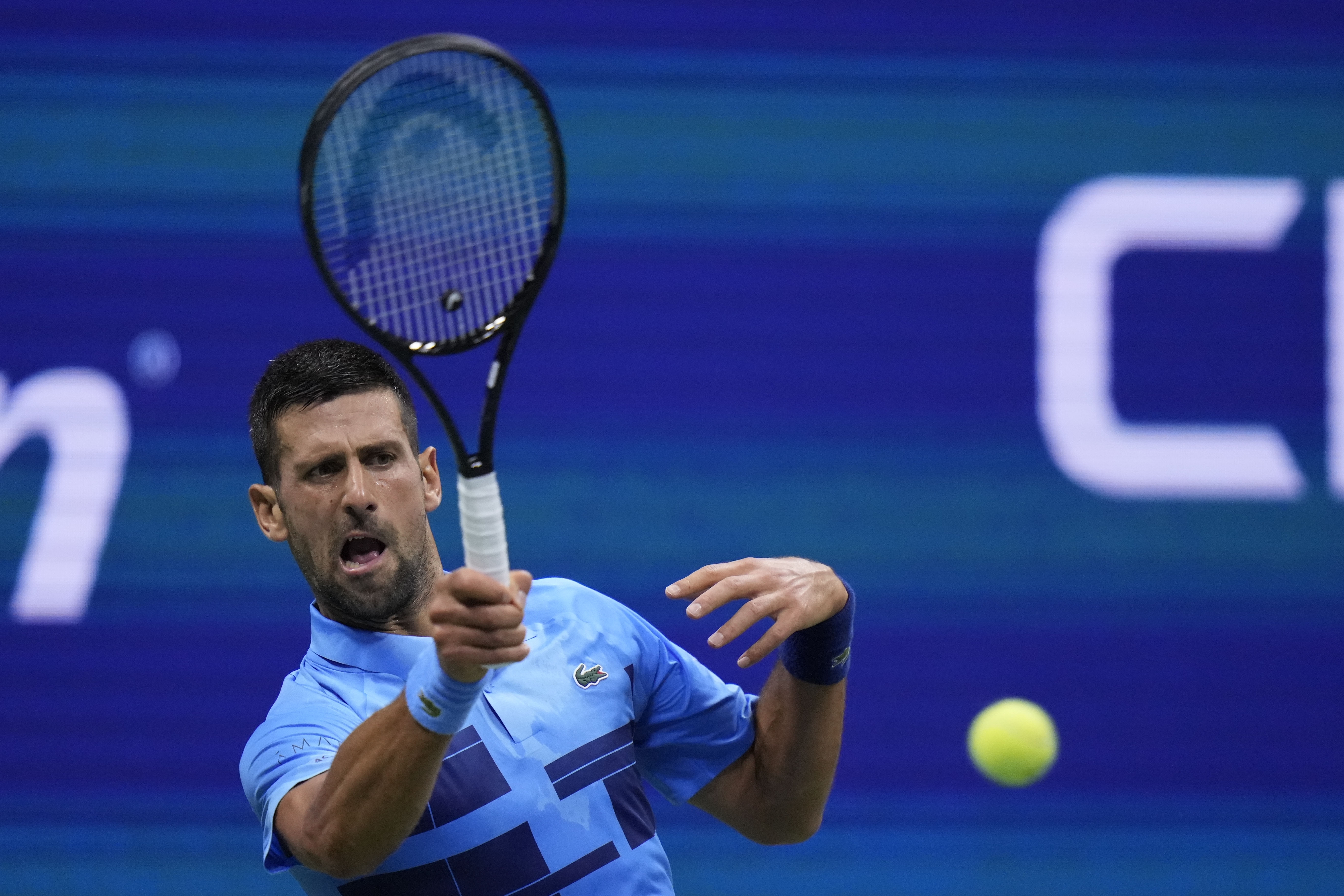 Novak Djokovic, of Serbia, returns a shot to Laslo Djere, of Serbia, during a second round match of the U.S. Open tennis championships, Wednesday, Aug. 28, 2024, in New York. 