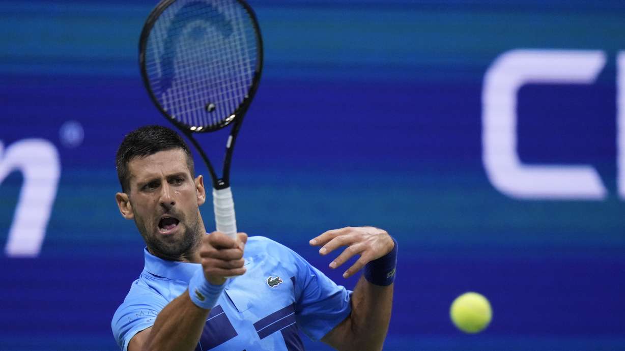Novak Djokovic, of Serbia, returns a shot to Laslo Djere, of Serbia, during a second round match of the U.S. Open tennis championships, Wednesday, Aug. 28, 2024, in New York.