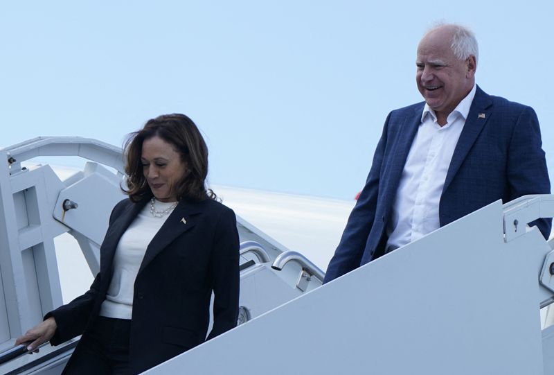 Democratic presidential nominee and Vice President Kamala Harris and vice presidential nominee Tim Walz walk down the steps from Air Force Two in Savannah, Ga., Thursday. Harris sat down for an interview Thursday.