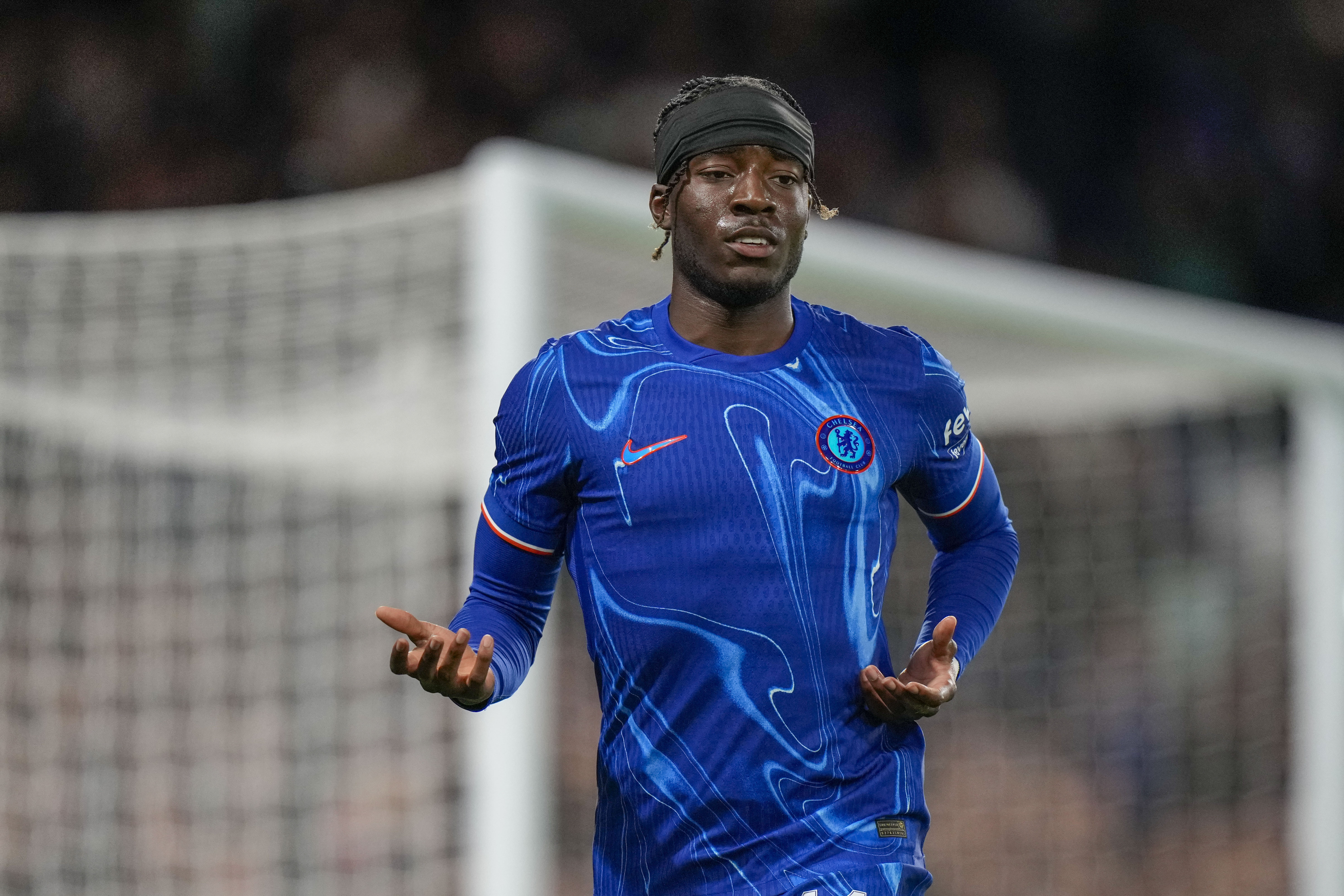 Chelsea's Noni Madueke celebrates after scoring his side's second goal during the Europa Conference League play-off first leg soccer match between Chelsea and Servette, at Stamford Bridge stadium in London, Thursday, Aug. 22, 2024.