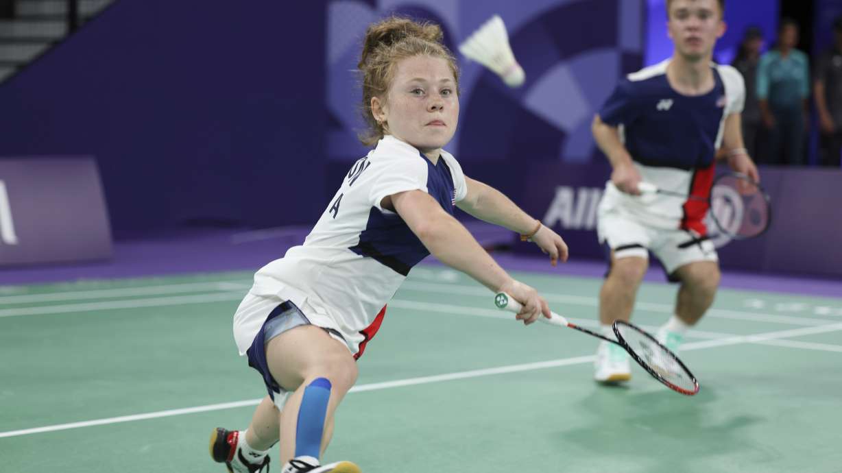 Jayci Simon, 19, left, and Mike Krajewski, 19, from the U.S., compete in their first doubles badminton match in the SH6 classification at Porte La Chapelle Arena during the Paralympic Games, on Thursday, Aug. 29, 2024, in Paris.