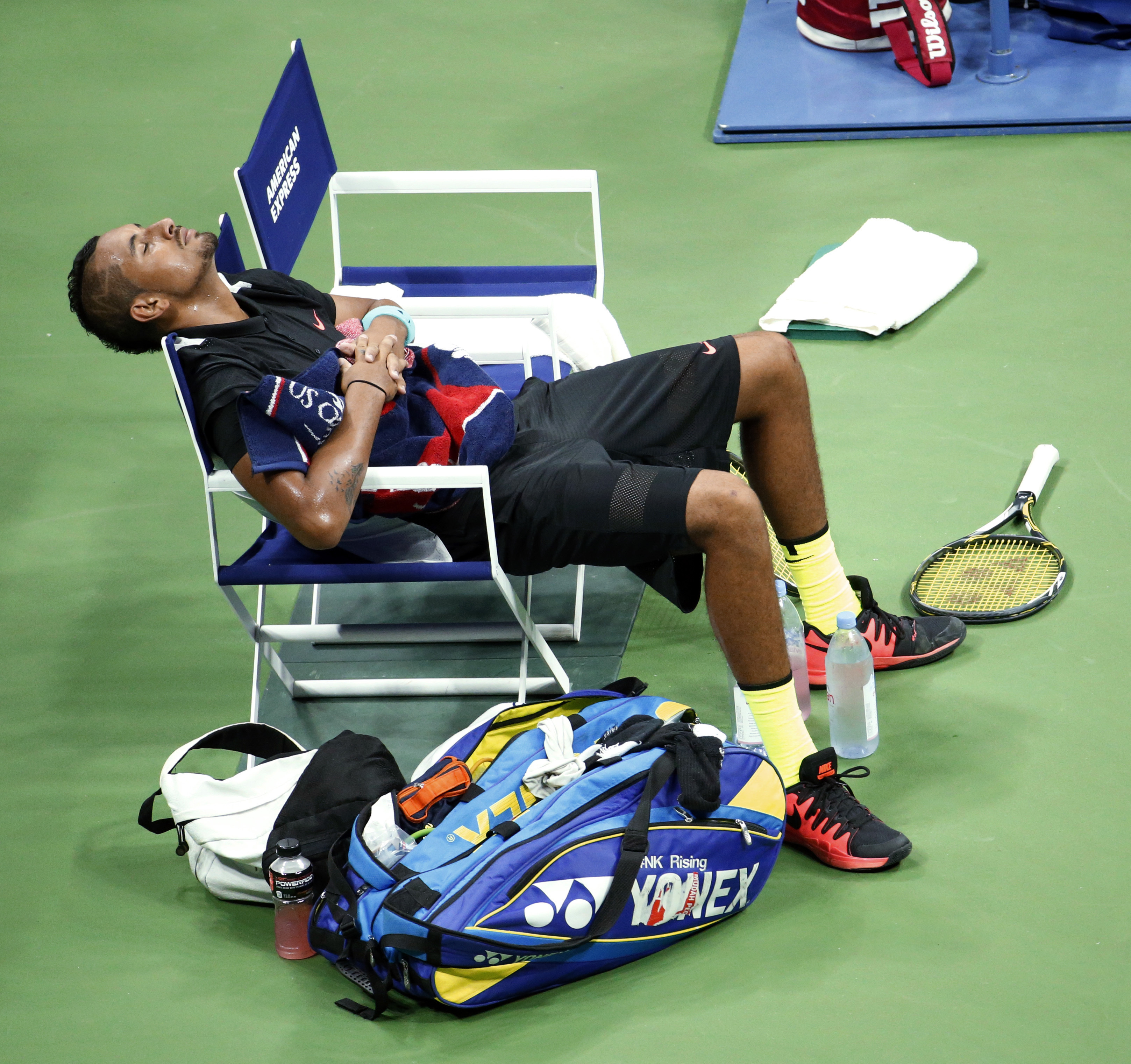 FILE -Nick Kyrgios, of Australia, rests on his chair before the third set against Andy Murray, of Britain, during the first round of the U.S. Open tennis tournament in New York, Sept. 1, 2015. 