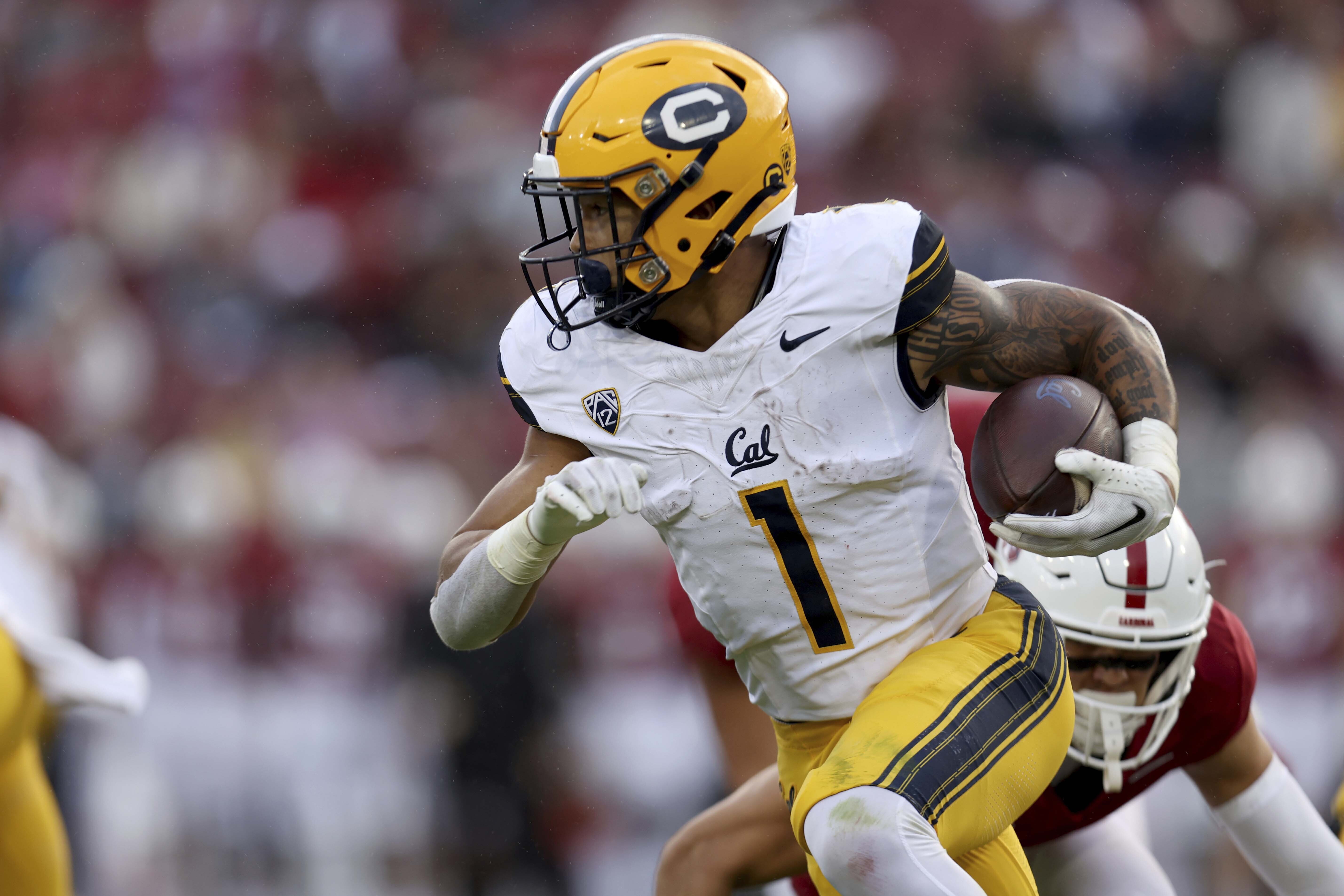 FILE - California running back Jaydn Ott runs against Stanford during the first half of an NCAA college football game in Stanford, Calif., Nov. 18, 2023. 