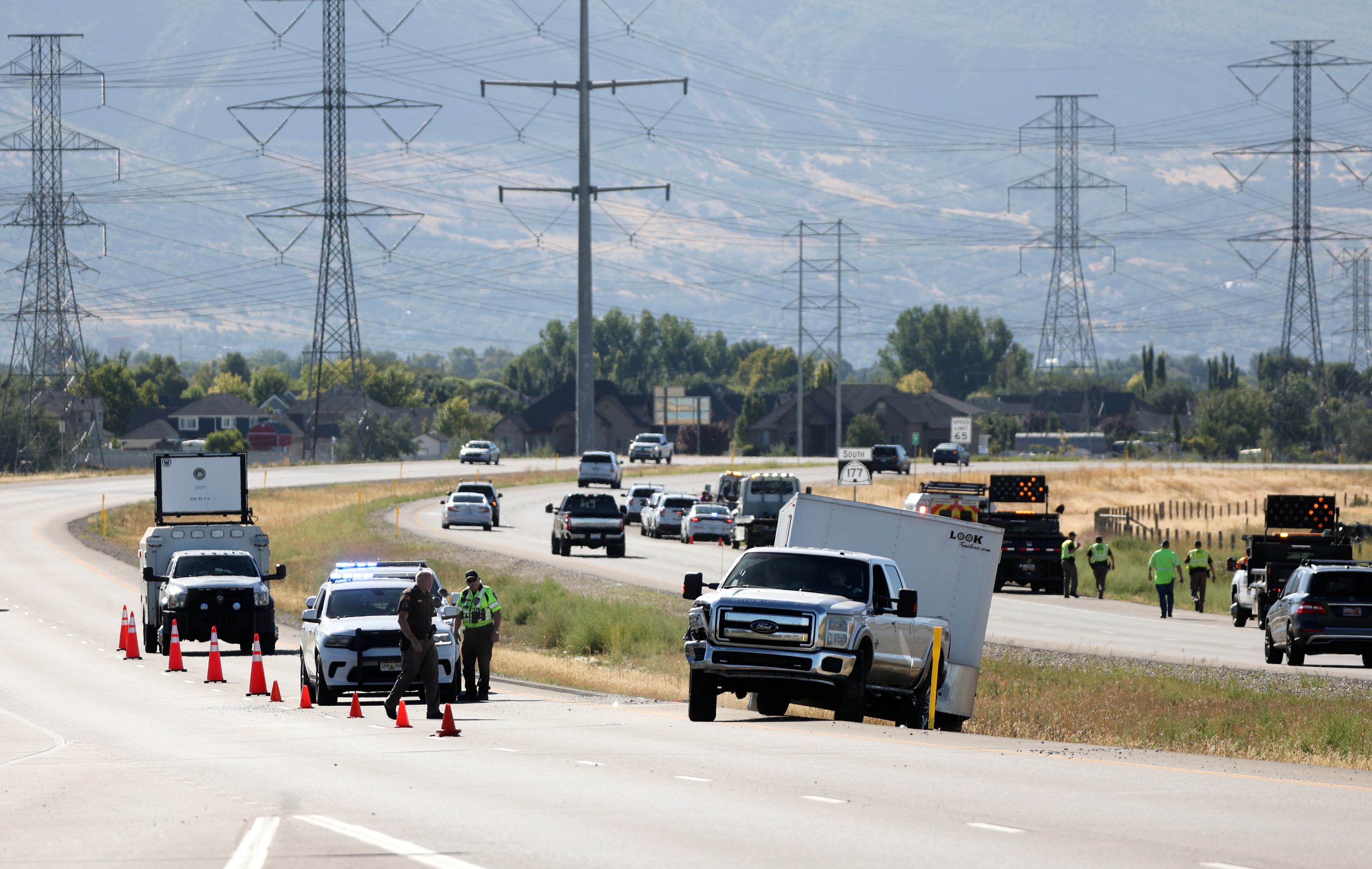 Emergency responders work at the scene of two crashes, one fatal, on the West Davis Corridor in Kaysville on Aug. 21. Utah reports that there have been 95 traffic fatalities in Utah so far this summer, already 17% more than last summer.