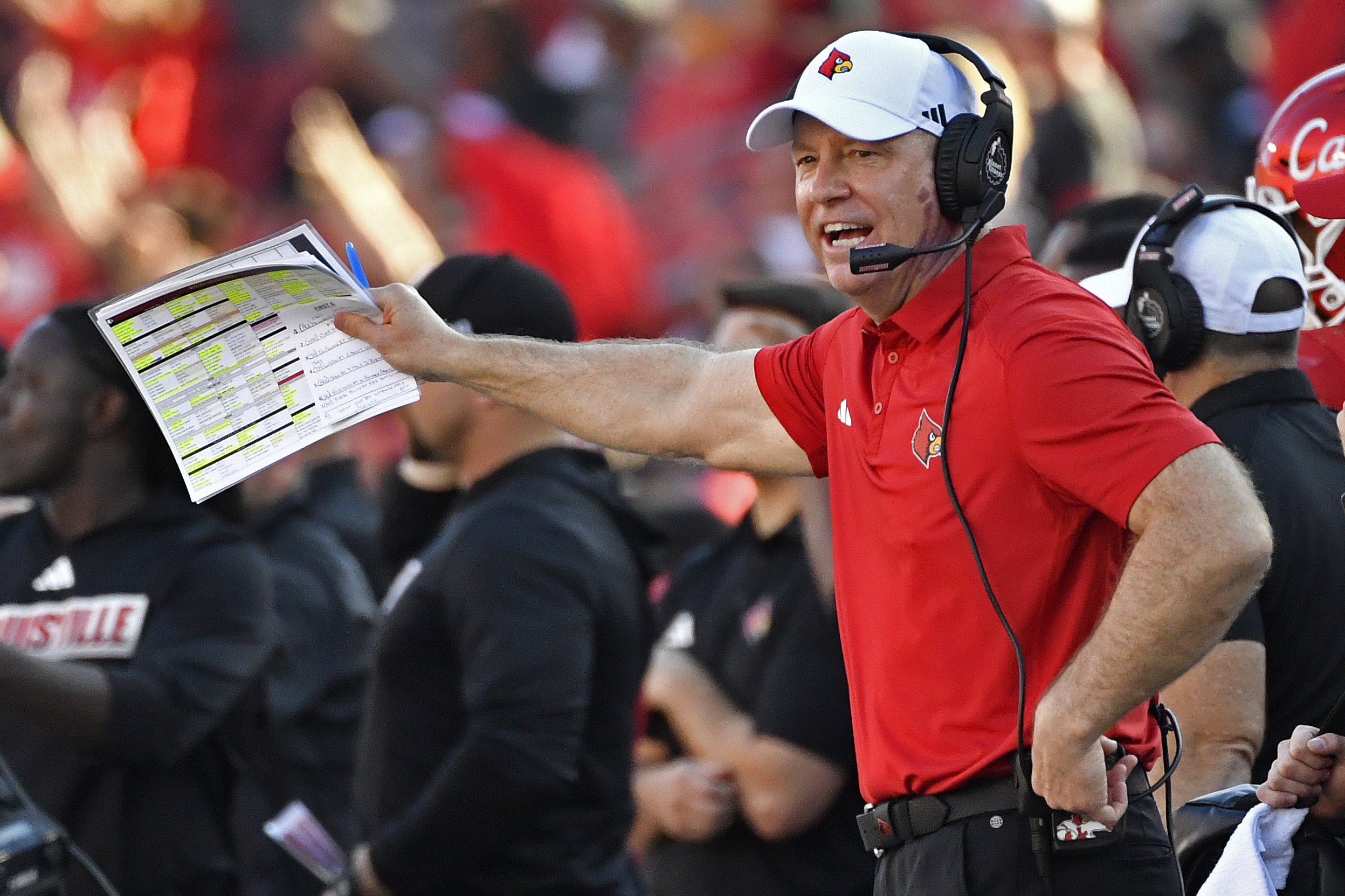 FILE - Louisville head coach Jeff Brohm shouts instructions to his team during the first half of an NCAA college football game in Louisville, Ky., Saturday, Sept. 23, 2023. 