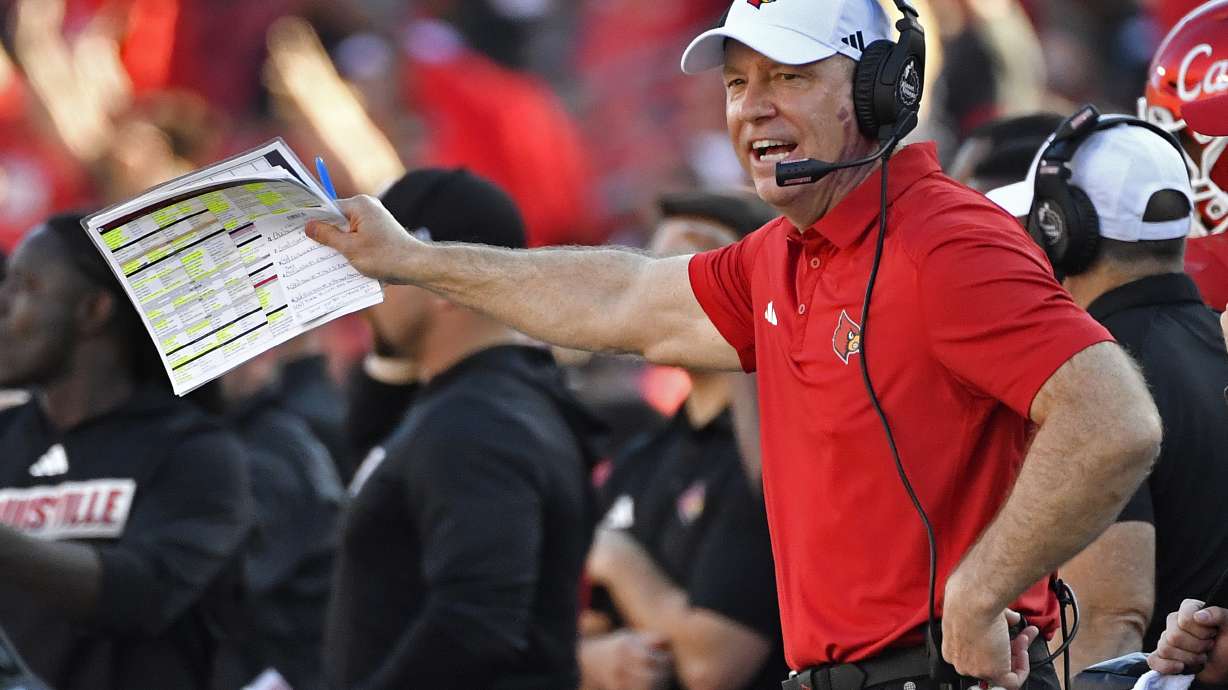 FILE - Louisville head coach Jeff Brohm shouts instructions to his team during the first half of an NCAA college football game in Louisville, Ky., Saturday, Sept. 23, 2023.