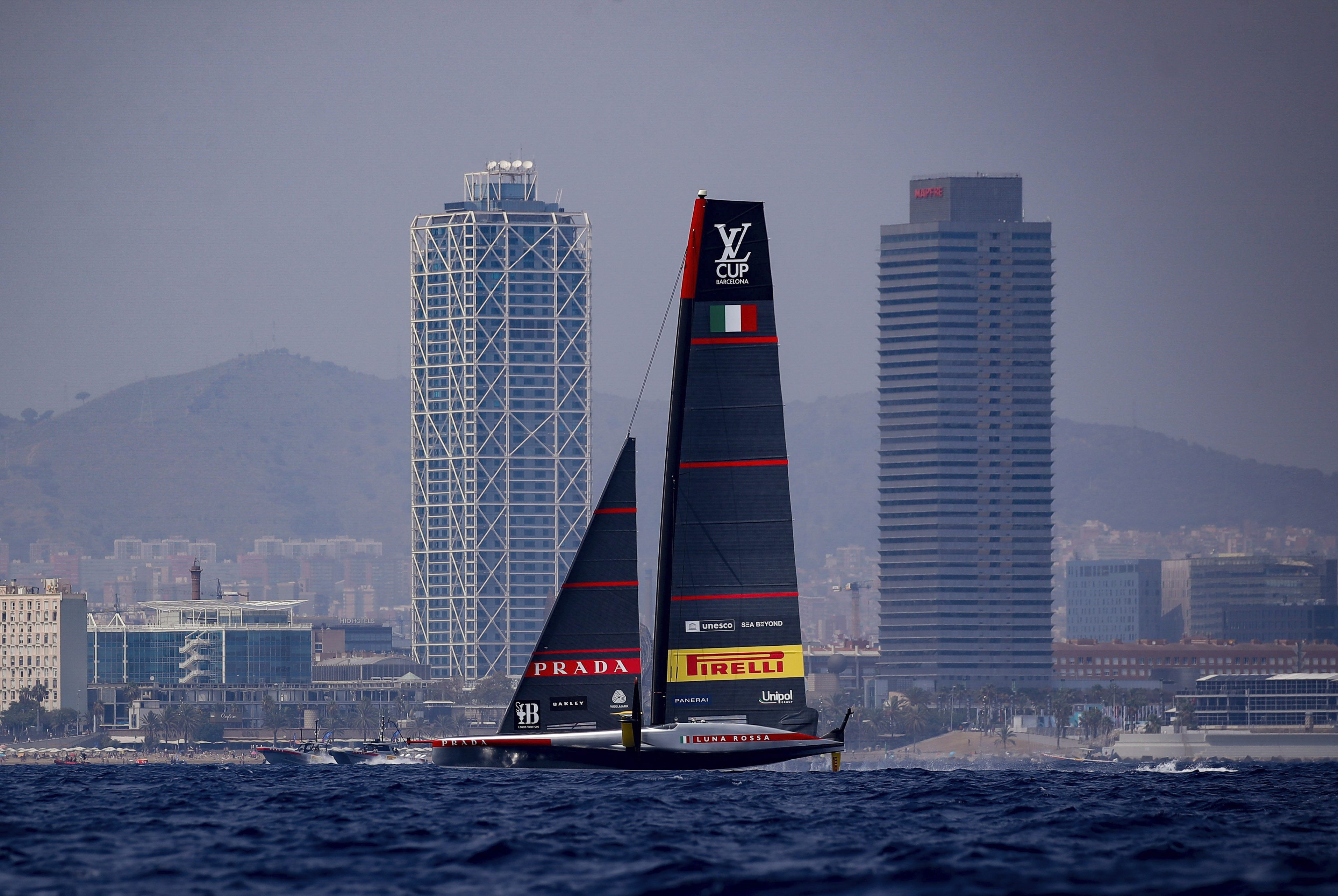 Luna Rosa Prada Pirelli Team's AC75 boat sails during America's Cup Preliminary Regatta ahead of the 37th America's Cup sailing race at the Barcelona's coast, Spain, Thursday, Aug. 22, 2024. The world's oldest international sports trophy, best yachtsmen and cutting-edge design and technology will come together in Barcelona when the 37th edition of the America's Cup starts on Thursday. 