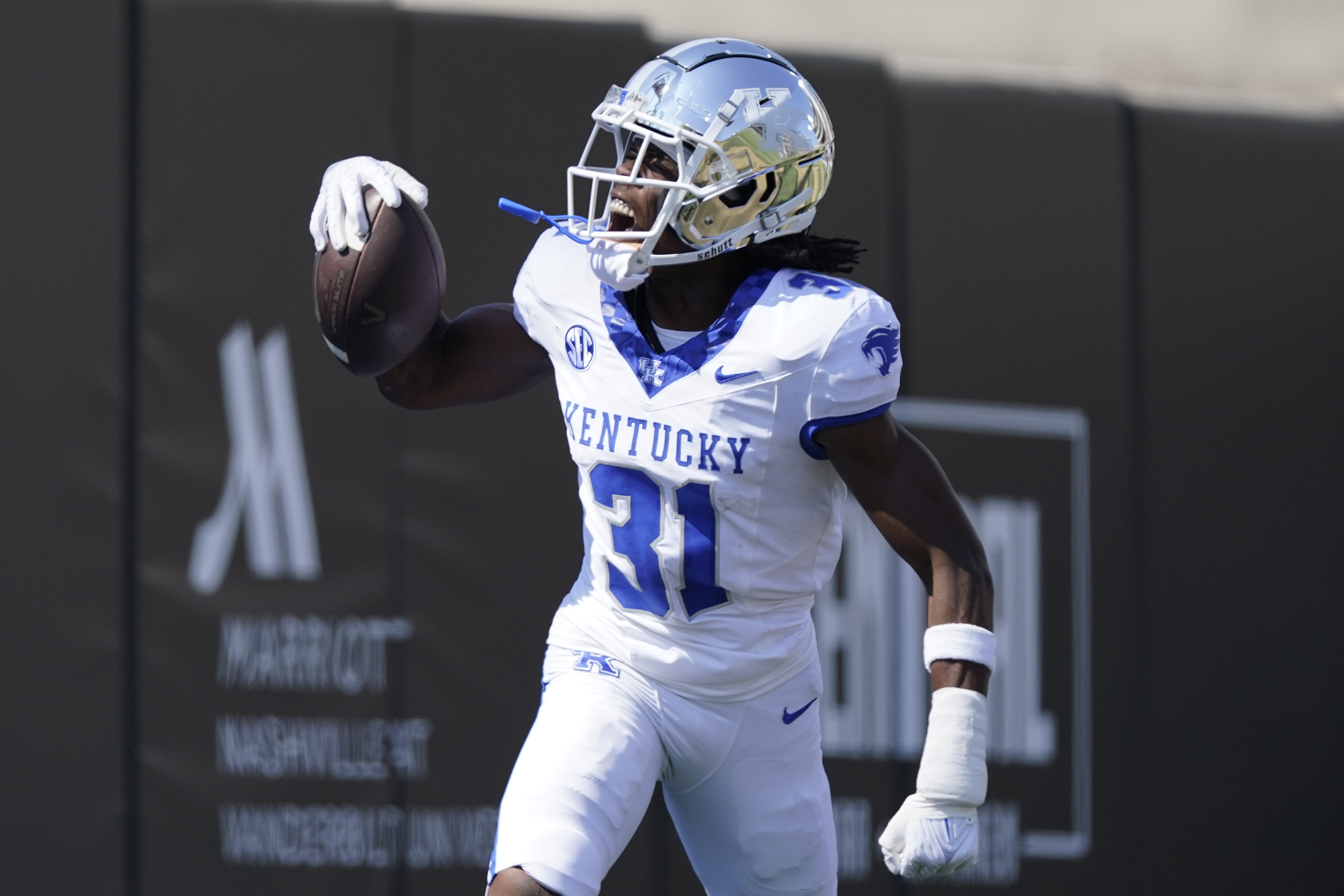 FILE - Kentucky defensive back Maxwell Hairston (31) celebrates his interception for a touchdown against Vanderbilt in the first half of an NCAA college football game Saturday, Sept. 23, 2023, in Nashville, Tenn. 