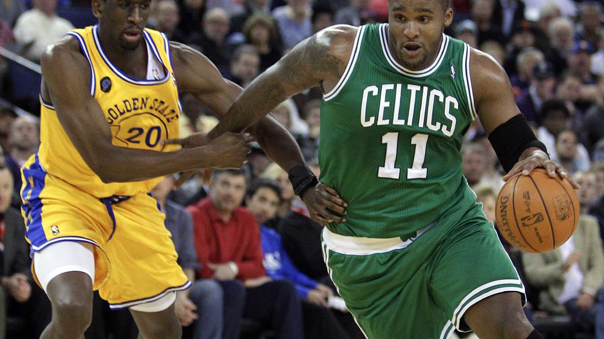 FILE - Boston Celtics' Glen Davis, right, drives the ball past Golden State Warriors' Ekpe Udoh (20) during the first half of an NBA basketball game, Feb. 22, 2011, in Oakland, Calif.