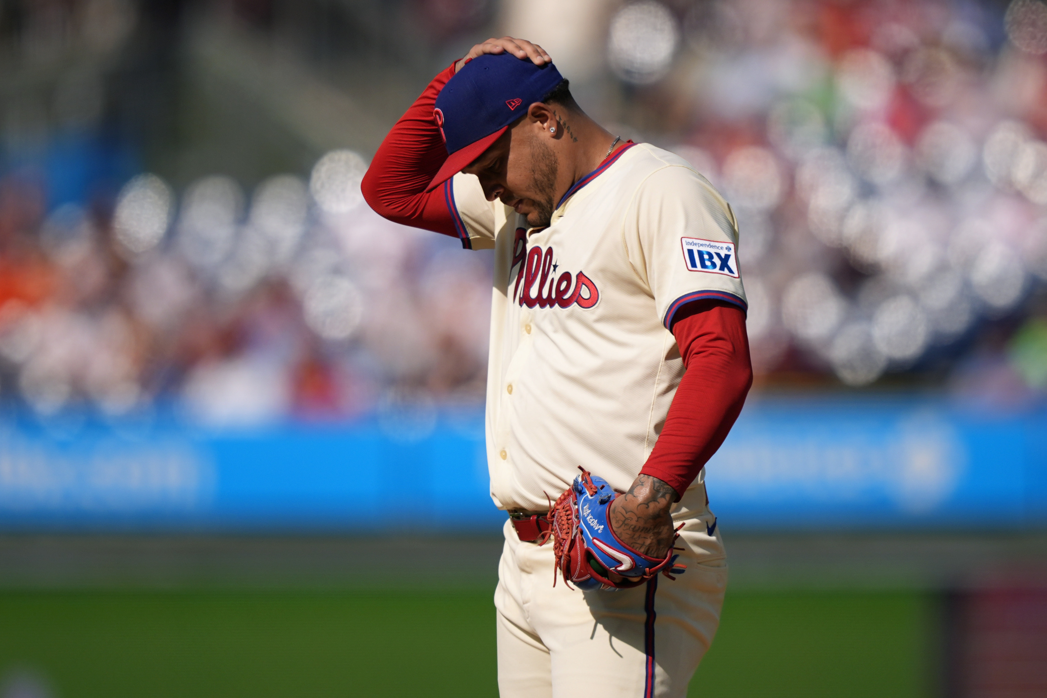 Philadelphia Phillies pitcher Taijuan Walker adjusts his hat during the first inning of a baseball game against the Houston Astros, Wednesday, Aug. 28, 2024, in Philadelphia. 