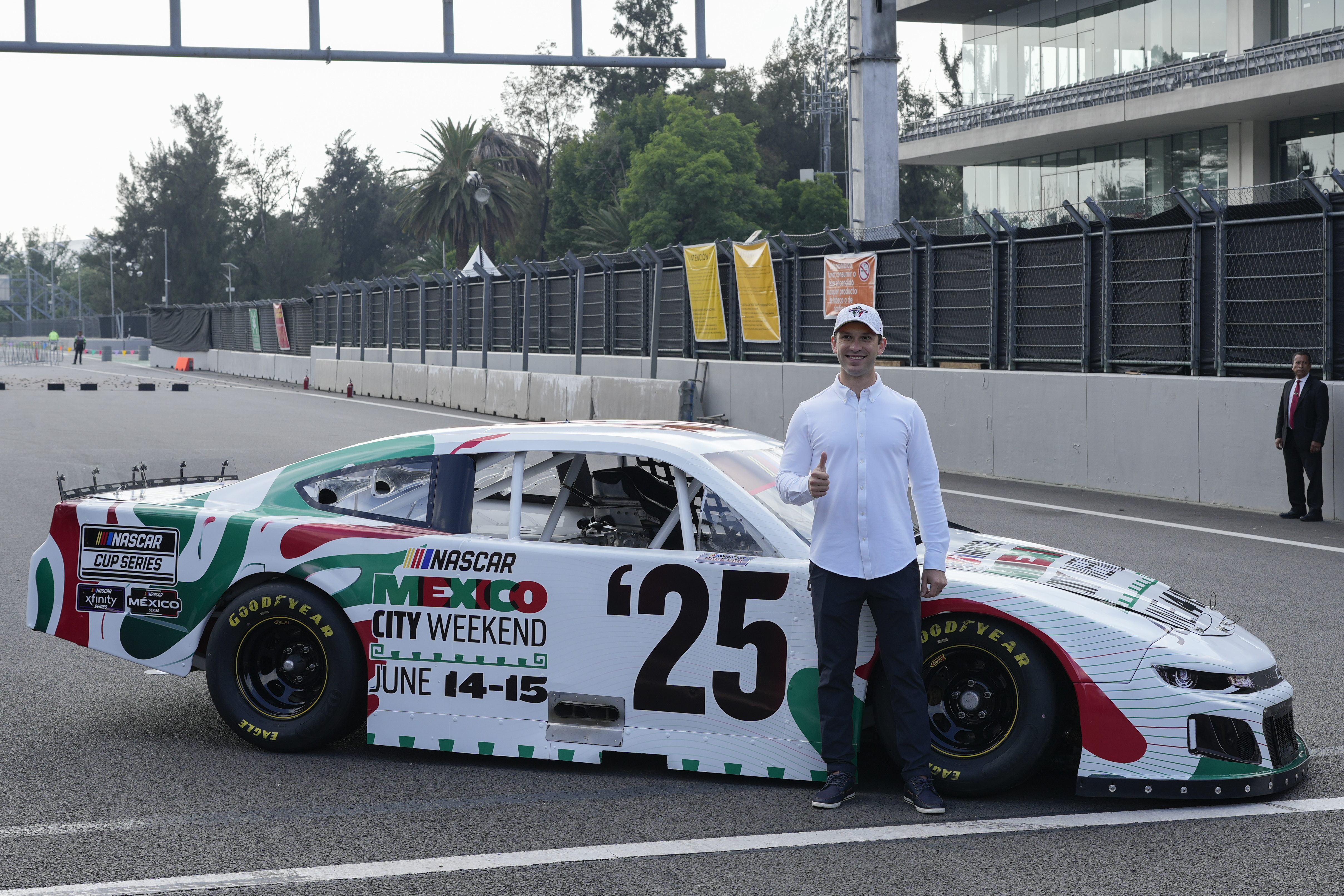 NASCAR driver Daniel Suarez, of Mexico, poses for a photo on the Autódromo Hermanos RodrÃguez track in Mexico City, Tuesday, Aug. 27, 2024.
