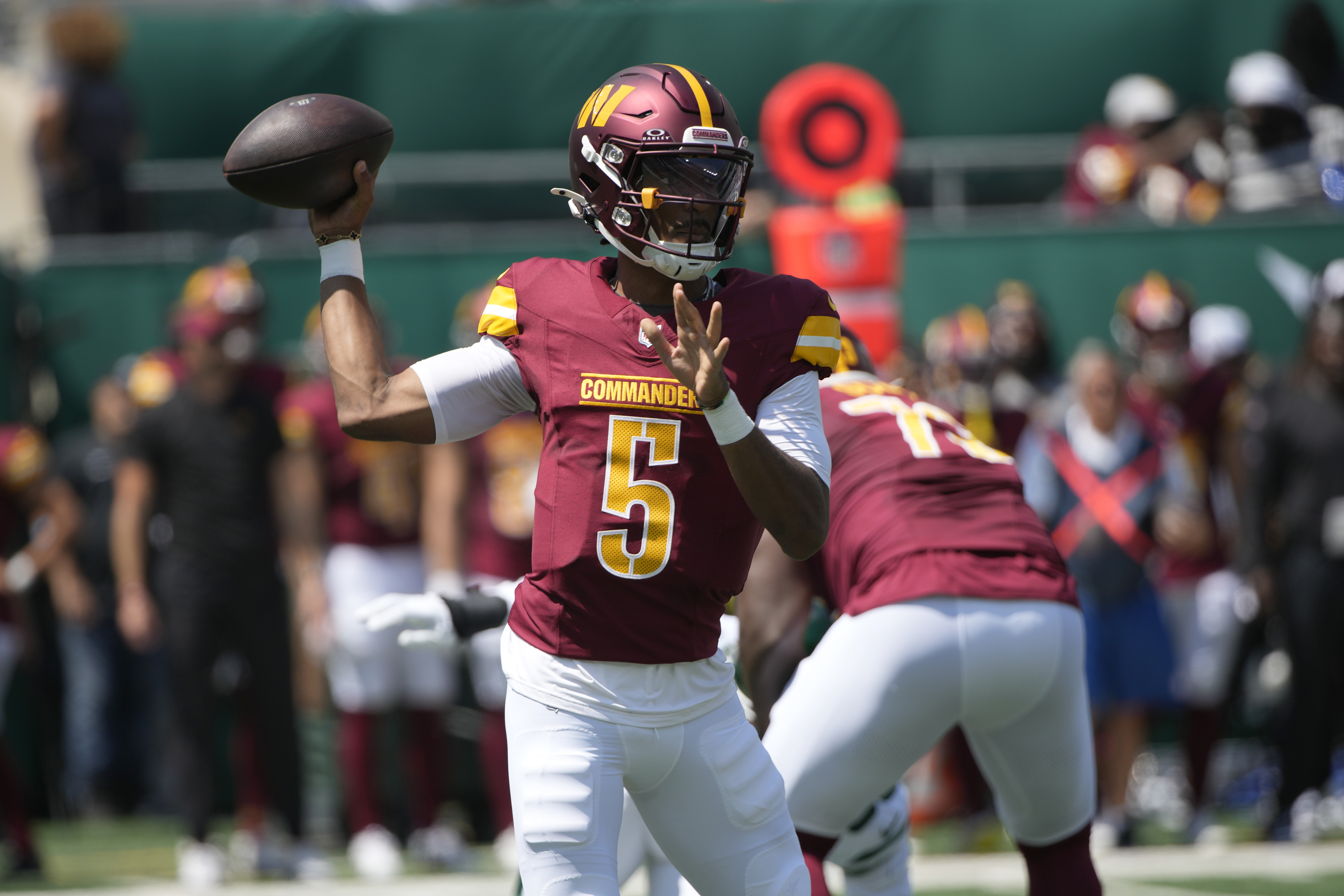 Washington Commanders quarterback Jayden Daniels throws during the first half of an NFL preseason football game against the New York Jets Saturday, Aug. 10, 2024, in East Rutherford. N.J. 