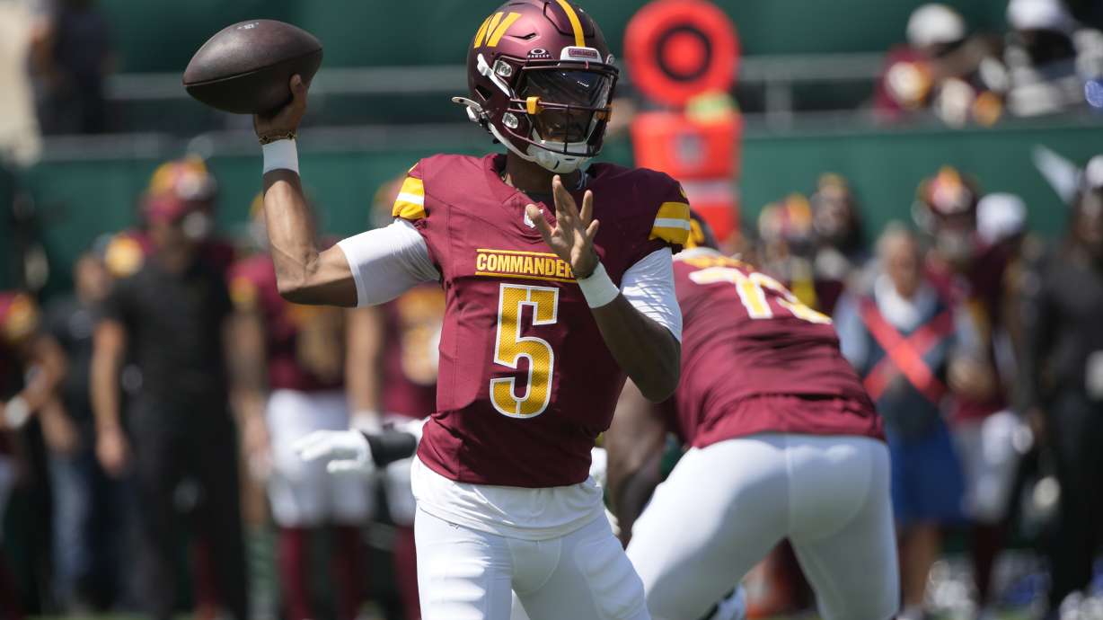 Washington Commanders quarterback Jayden Daniels throws during the first half of an NFL preseason football game against the New York Jets Saturday, Aug. 10, 2024, in East Rutherford. N.J.