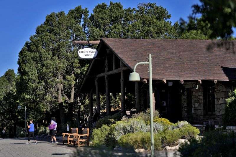 Guests exit the Bright Angel Lodge, as visitors won't be able to stay overnight after a series of breaks in the only pipeline that serves the popular tourist destination, Thursday in Grand Canyon, Ariz.