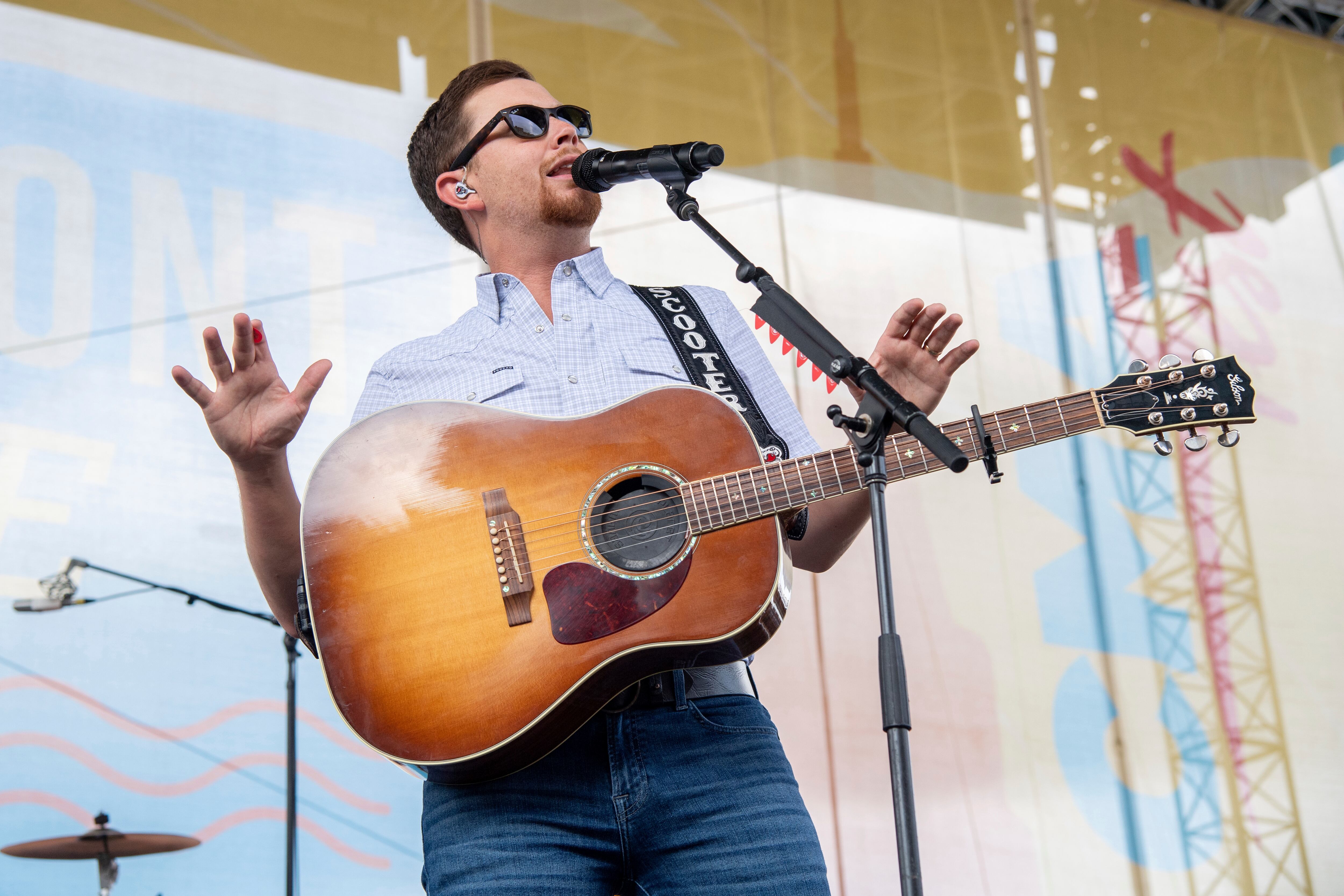 Scotty McCreery halted his concert after man in the audience allegedly assaulted a woman