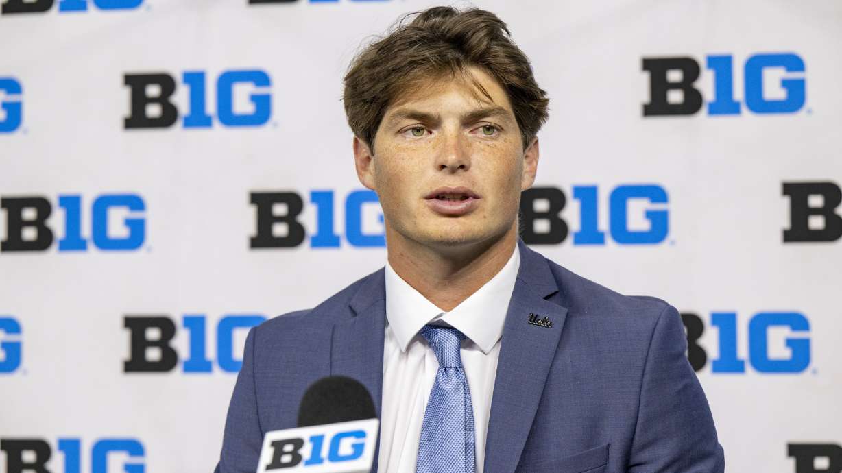 FILE - UCLA's Ethan Garbers talks with reporters during an NCAA college football news conference at the Big Ten Conference media days at Lucas Oil Stadium, July 24, 2024, in Indianapolis.